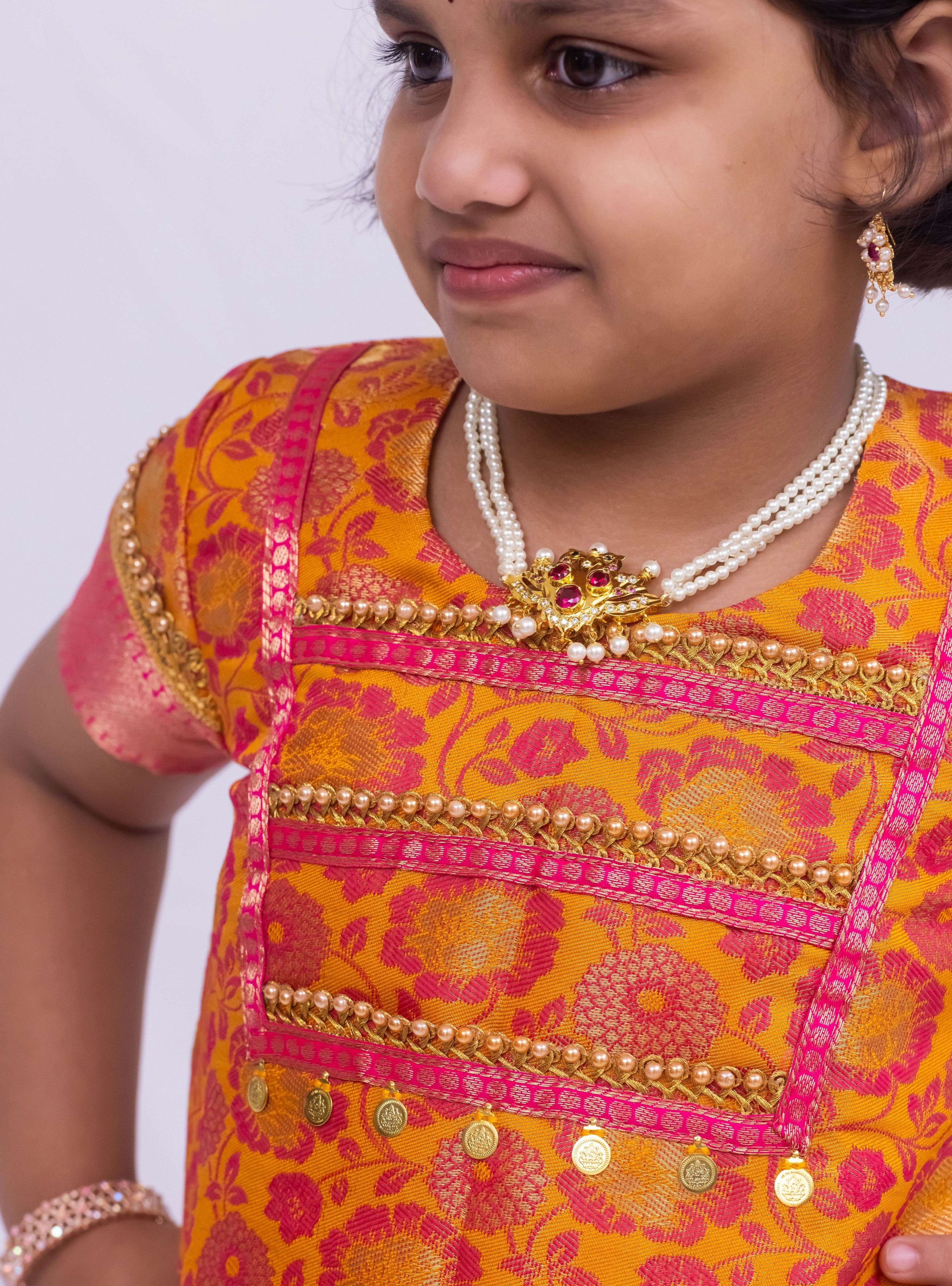 Yellow -Pink banarasi jacquard brocade  Parkar Polka set with a heavy yoke pattern for Girls.Let your princess be as comfortable as in her casuals with carefully designed & crafted Comfort Ethnic Wear by Soyara Ethnics.Keep her fashion quotient high with timeless patterns, vibrant combinations and royal textiles.