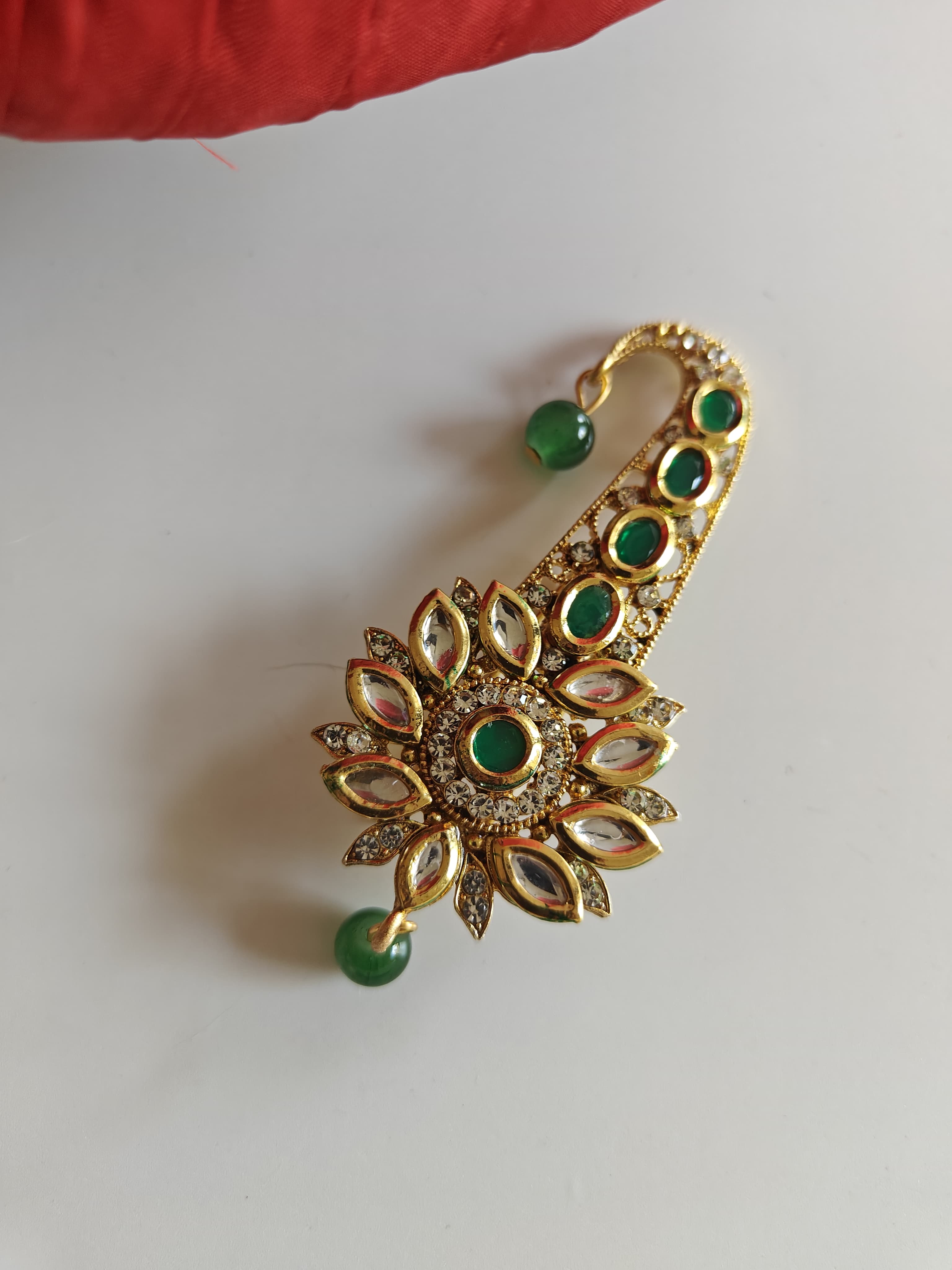 Green and white Kundan Jadau pagadi brooch for batu or groom.