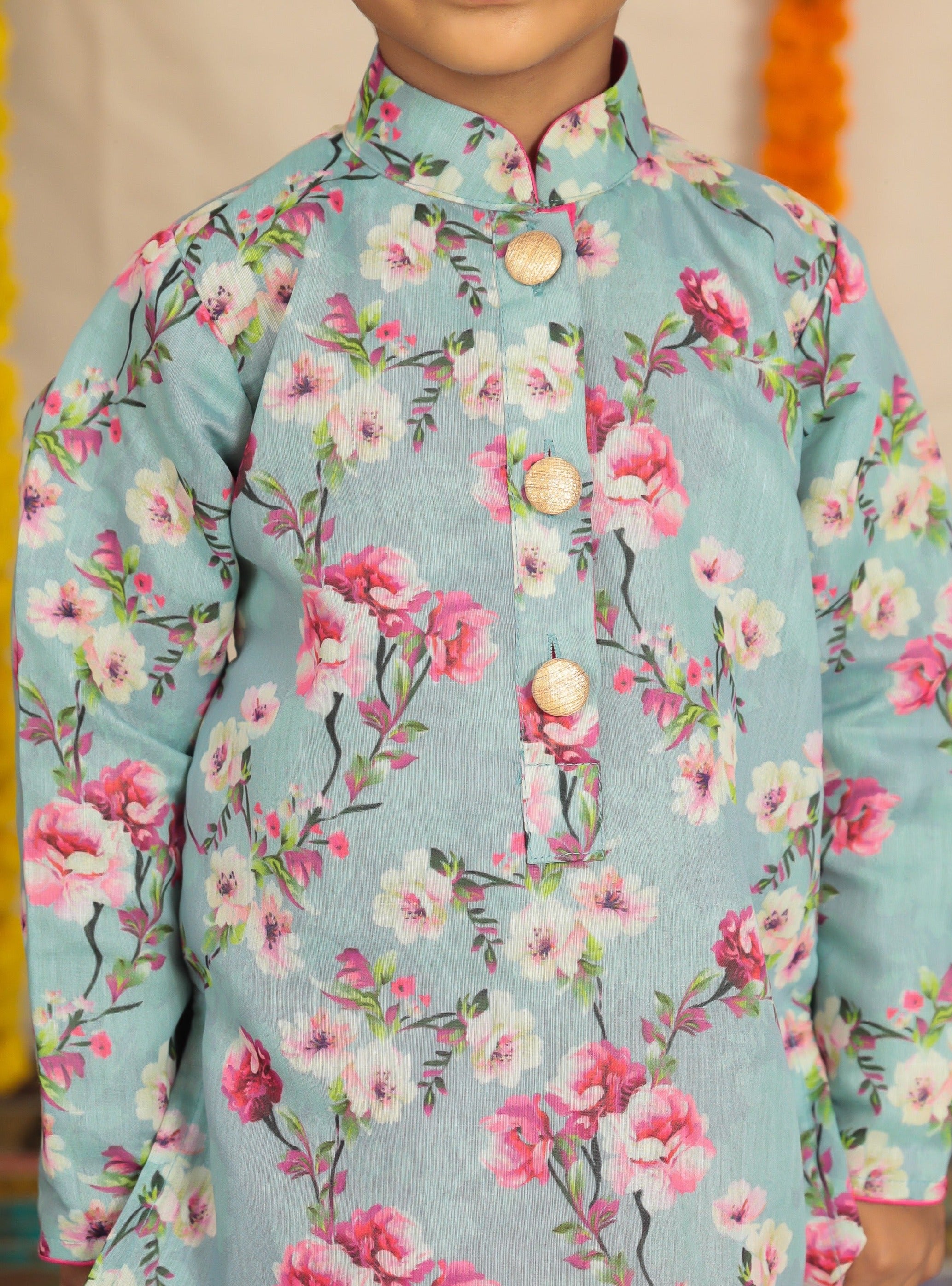 Grey floral printed kurta with pink cotton silk dhoti.Kurtas with collar or Angrakha pattern teamed with salwar are the best choice for any festive occasion for boys. They are Trendy, Easy to wear and comfortable to carry.