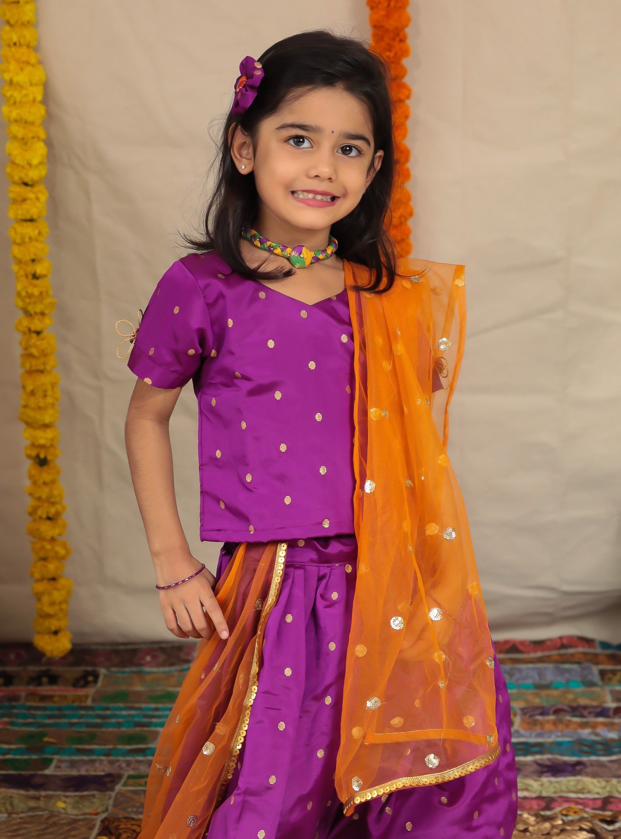 Purple Taffeta Silk Ghagra Choli with a broad statement Paithani Border for girl.Let your princess be as comfortable as in her casuals with carefully designed & crafted Comfort Ethnic Wear by Soyara Ethnics.Keep her fashion quotient high with timeless patterns, vibrant combinations and royal textiles.