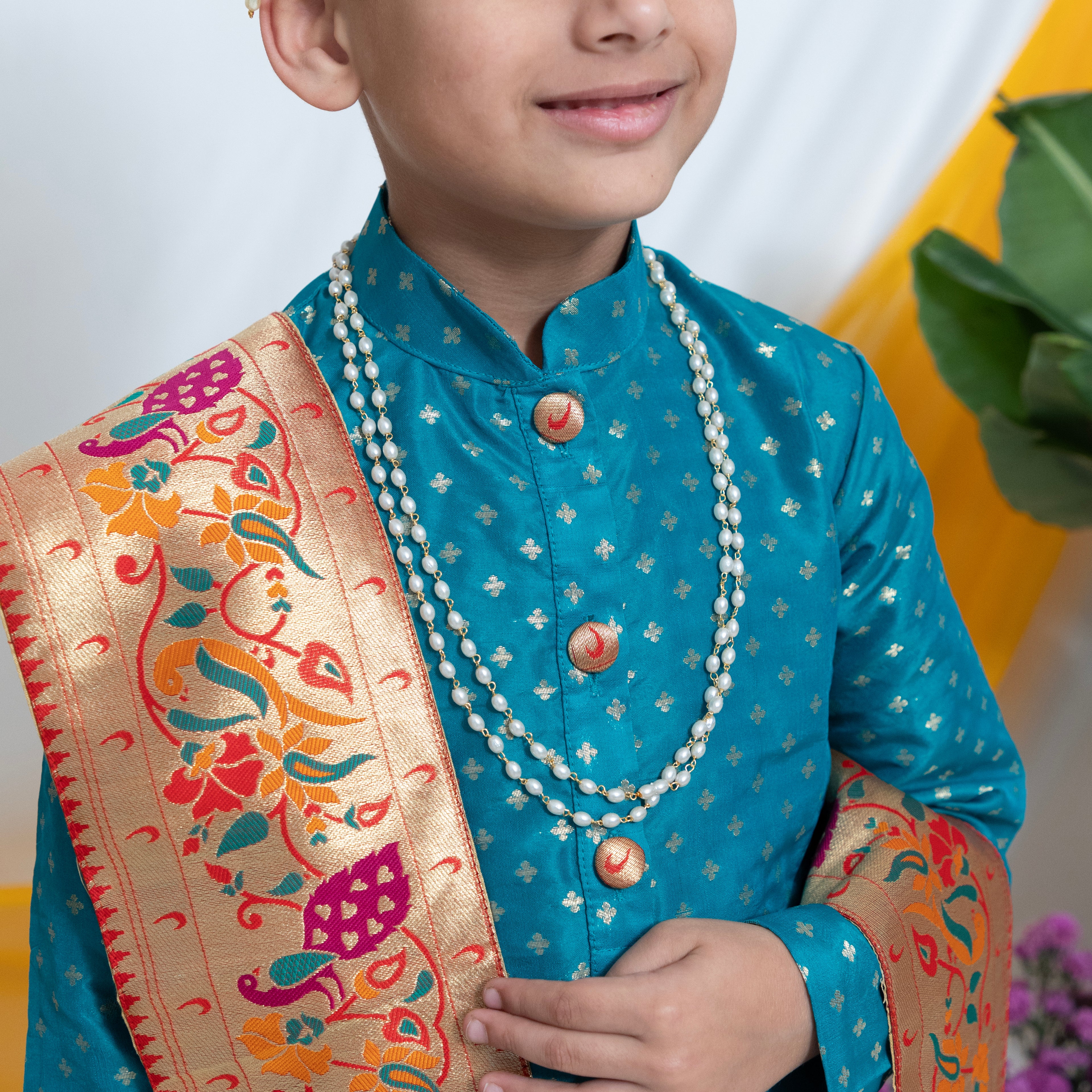 Double Layered Plain oval shaped pearls kanthi for Batu.It is worn by Batu for Vratabandh/Munj/Upnayan/ Thread Ceremony.Mundavalya,kanthi,bhikbali,topi,pagdi are boys accessories exclusively designed using Pearls,glass beads,jadau & gold plated findings for Batu,for Upanayan/Vratabandha/munj /thread ceremony.