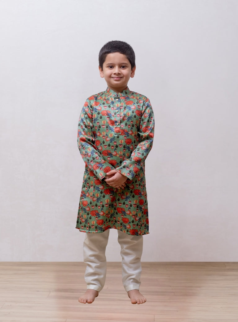 This Sage Green tussar silk kurta features a lotus print and a stand collar accented with stone buttons. It is lined with cotton on the inside to provide enhanced comfort and superior quality.