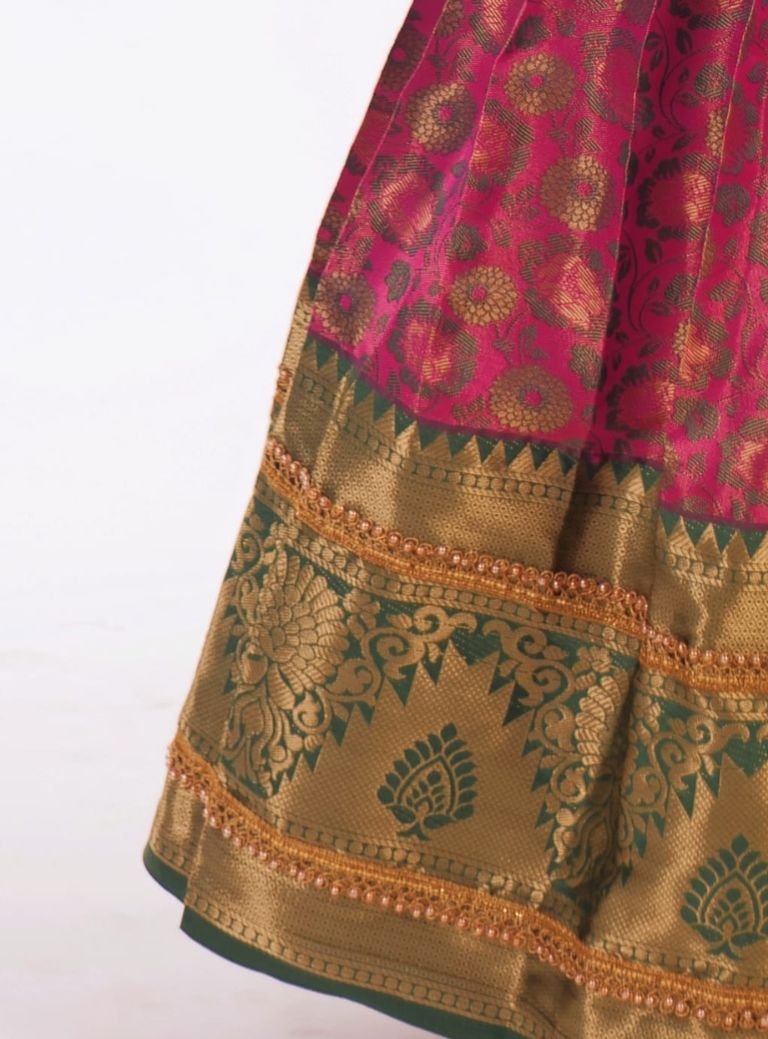 Pink and Dark Green woven banarasi jacquard brocade Pattu Pavada Parkar Polka set with a heavy yoke pattern for Girls.Let your princess be as comfortable as in her casuals with carefully designed & crafted Comfort Ethnic Wear by Soyara Ethnics.Keep her fashion quotient high with timeless patterns, vibrant combinations and royal textiles.
