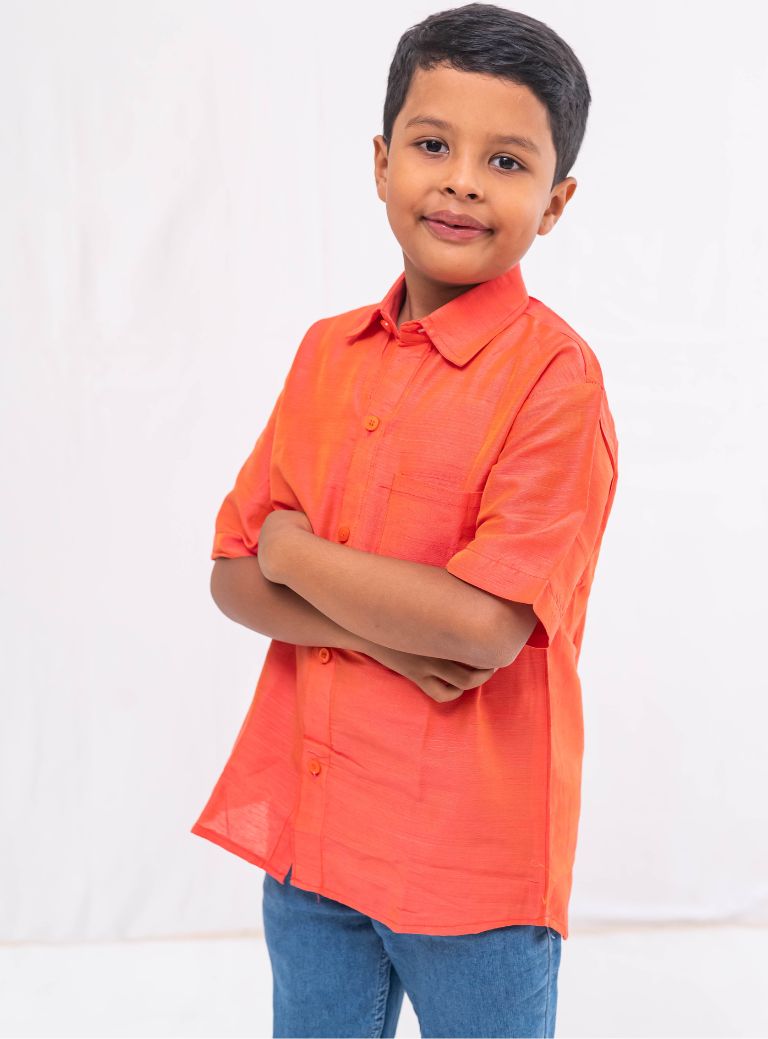 Coral orange Plain Raw silk half sleeved shirt for Boys.This Coral orange Plain Raw silk half sleeved shirt is designed for boys, providing both comfort and style.
