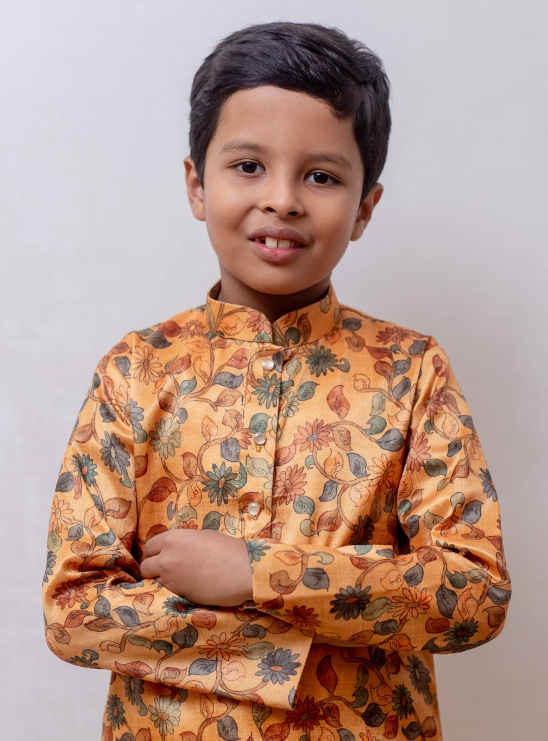 Amber coloured floral printed tussar silk kurta with stand collar for Boys