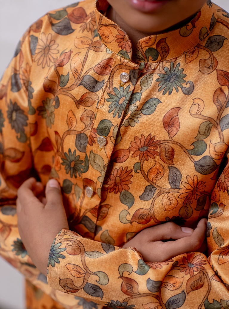 Amber coloured floral printed tussar silk kurta with stand collar for Boys
