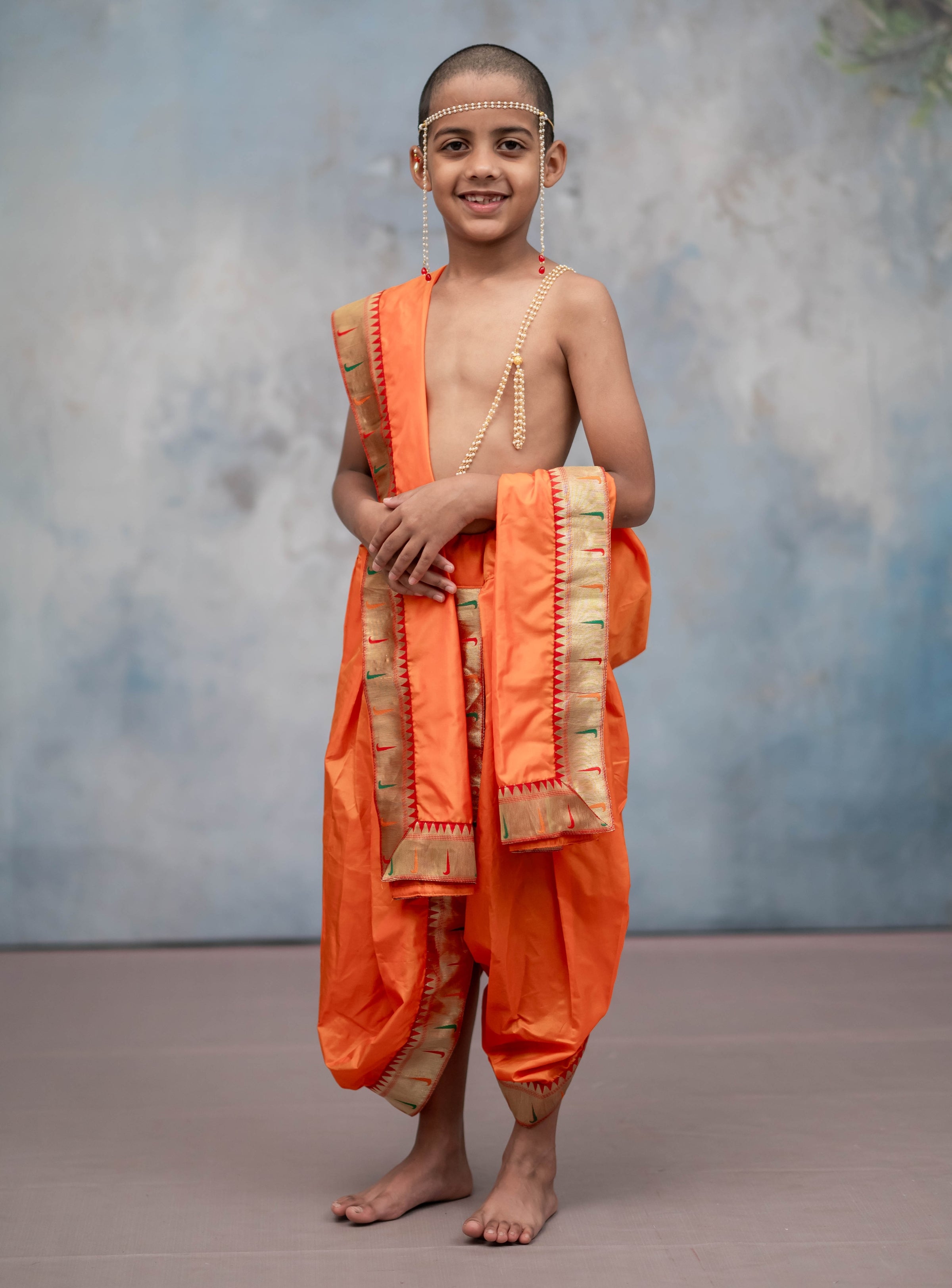 Saffron Mysore silk sovale uparane set with Muniya Paithani border for Batu.Pre-stitched sovale uparane set includes Ready to wear Sovale & Uparane/Upavastra.Can be paired with a short kurta.This Set is ideal for rituals like Matrubhojan,Muhurt during Munj/Upanayan/Vratabandha/Thread Ceremony.