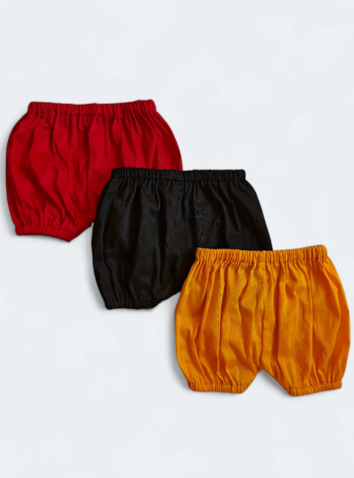 Set of 3 common coloured Baby Bloomers to use over a diaper for Newborn.Golden brocade bonnet,paithani booties,fabric headbands all these Handcrafted accessories for Newborn are perfect add ons to any traditional attire of the baby. Designer baby mats, set of generic bloomers are the other naming ceremony essentials.