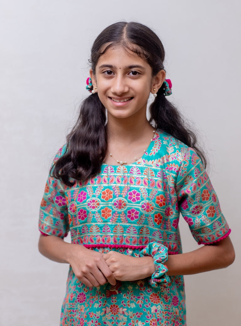 Turquoise soft silk Banaras brocade kurti with yoke pattern embellished with contrast pompom lace for Girls
