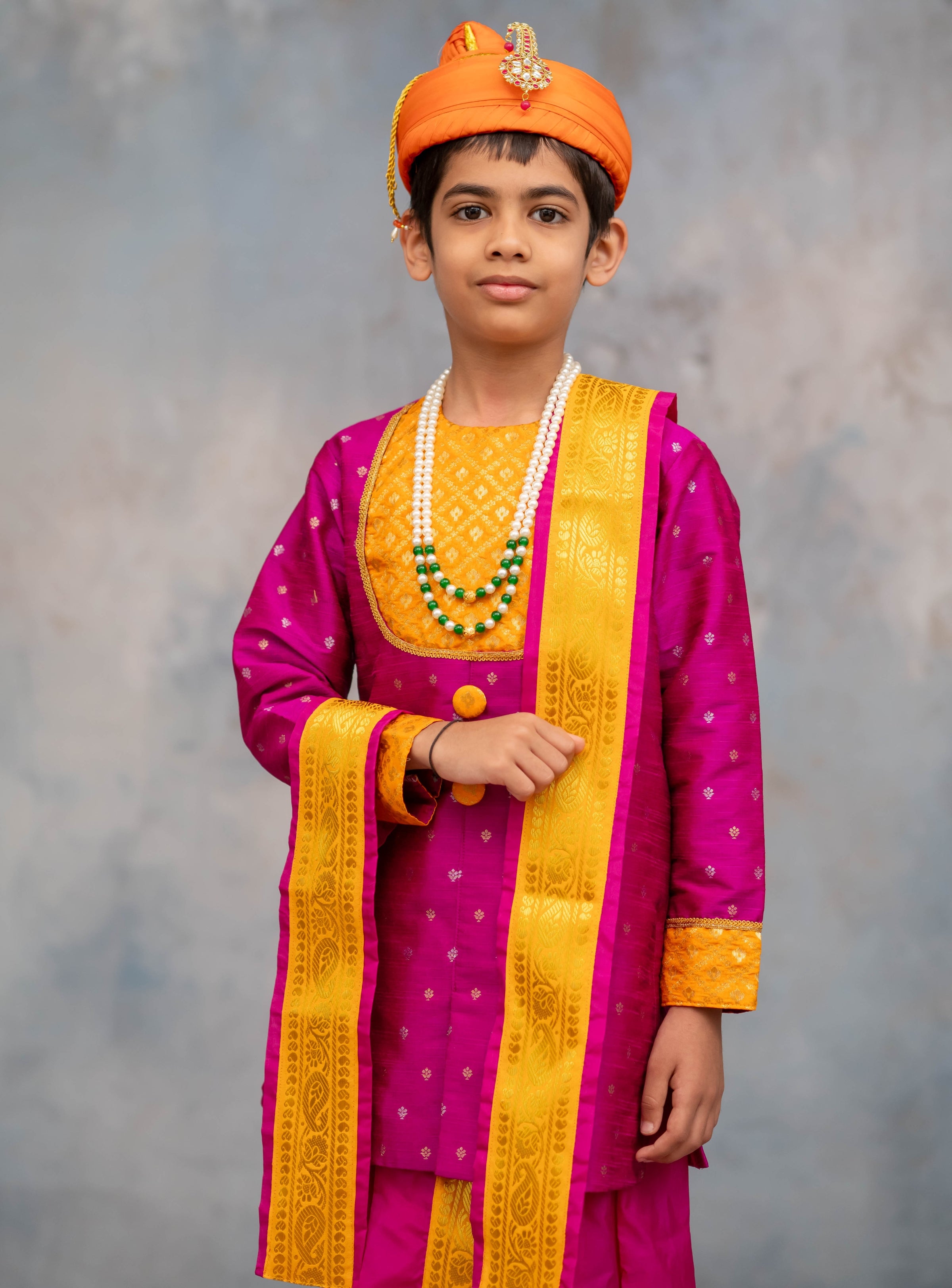 Magenta raw silk with jari butta short kurta with same coloured sovale and shela set with yellow border for Batu.Pre-stitched sovale uparane set includes Ready to wear Sovale & Uparane/Upavastra.Can be paired with a short kurta.This Set is ideal for rituals like Matrubhojan,Muhurt during Munj/Upanayan/Vratabandha/Thread Ceremony.