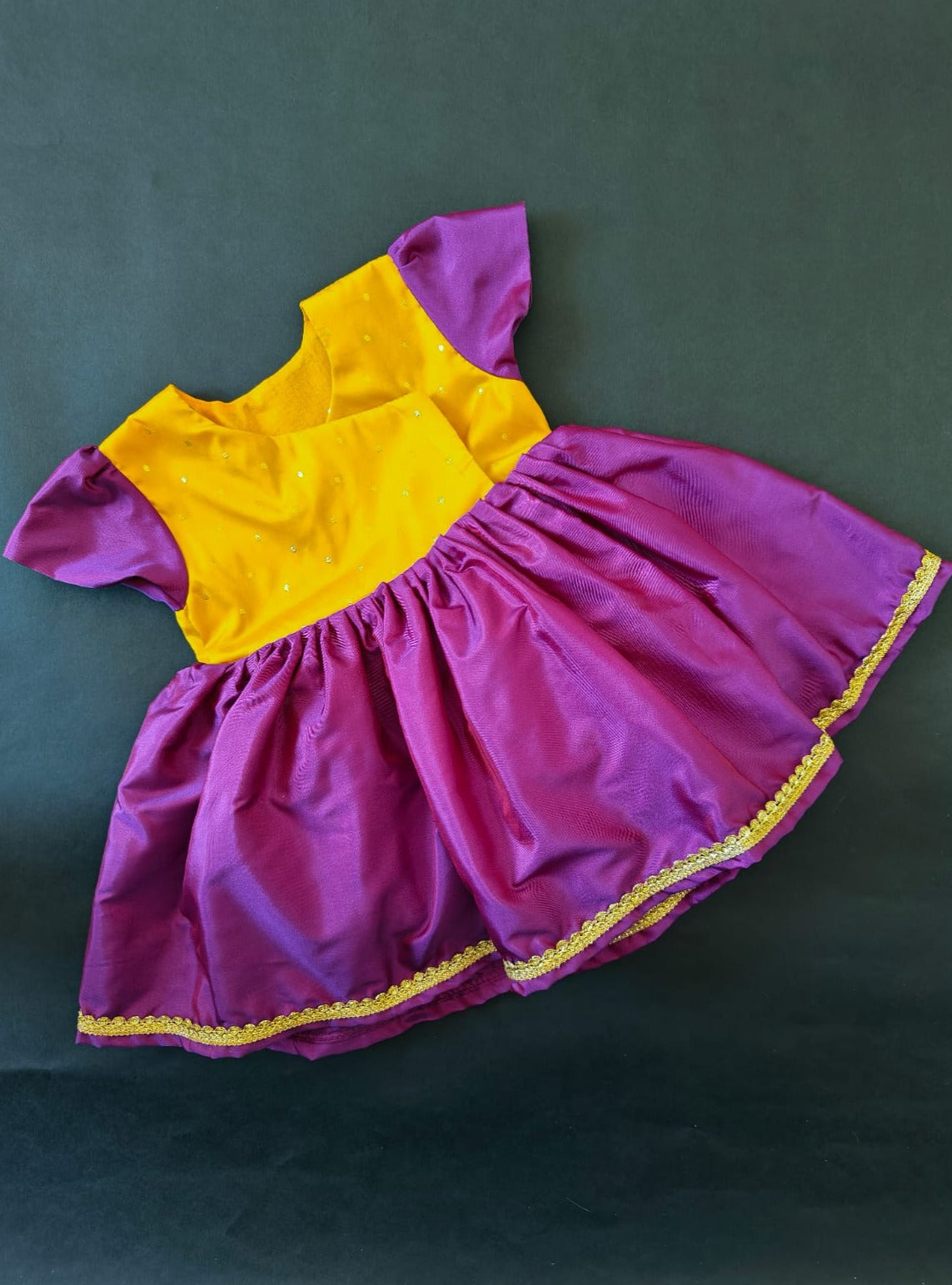 Yellow brocade & Purple silk front open dress for new born Baby Girl provides max comfort. It's the perfect outfit for your baby's naming ceremony , naamkaran or annaprashan ceremony. Traditional and ethnic dress for Noolukettu Ceremony, Pachavi Puja, cradle ceremony,Rice Ceremony,Chatti Puja etc. Apt gifting idea.
