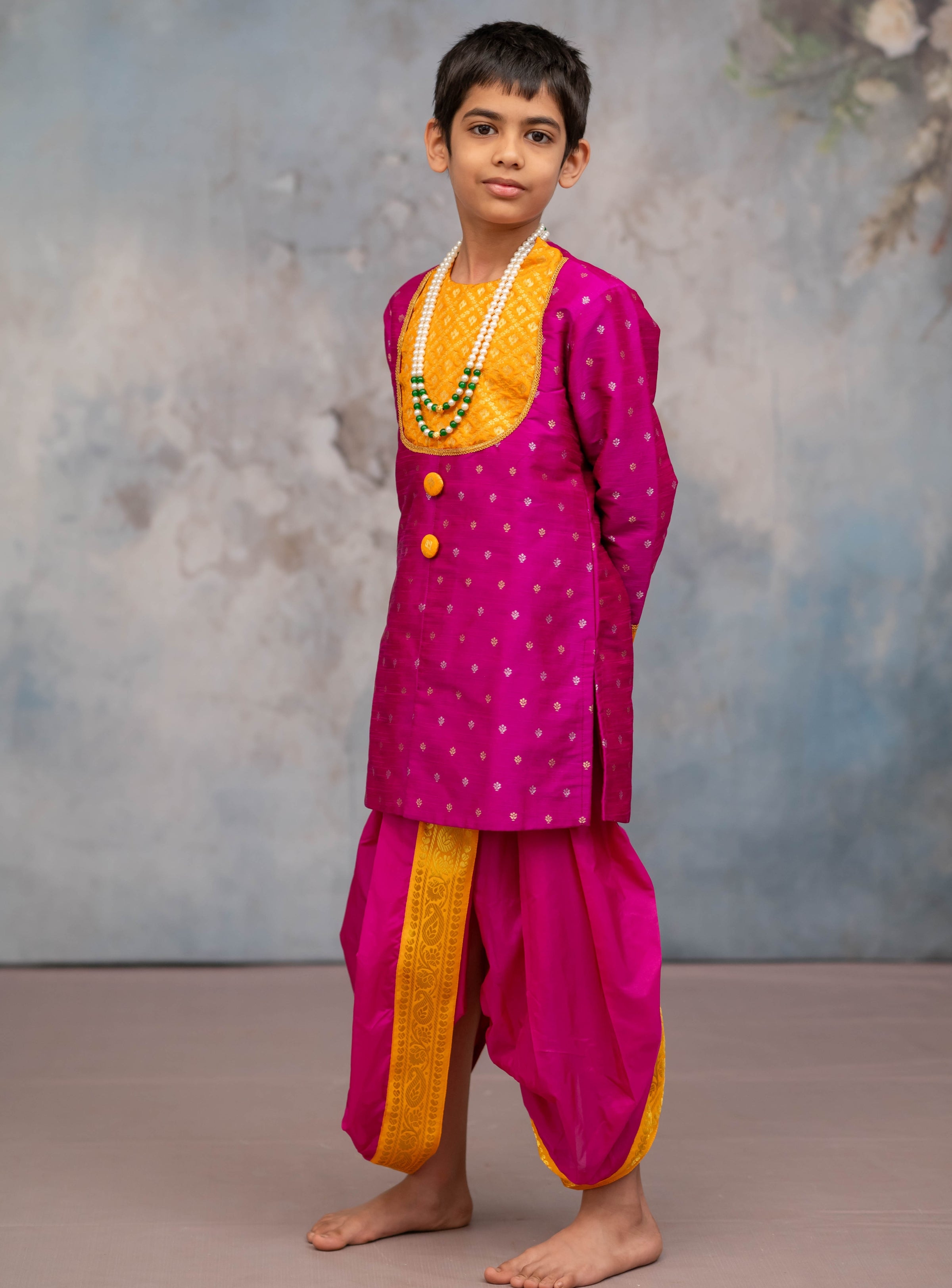 Magenta raw silk with jari butta short kurta with same coloured sovale and shela set with yellow border for Batu.Pre-stitched sovale uparane set includes Ready to wear Sovale & Uparane/Upavastra.Can be paired with a short kurta.This Set is ideal for rituals like Matrubhojan,Muhurt during Munj/Upanayan/Vratabandha/Thread Ceremony.