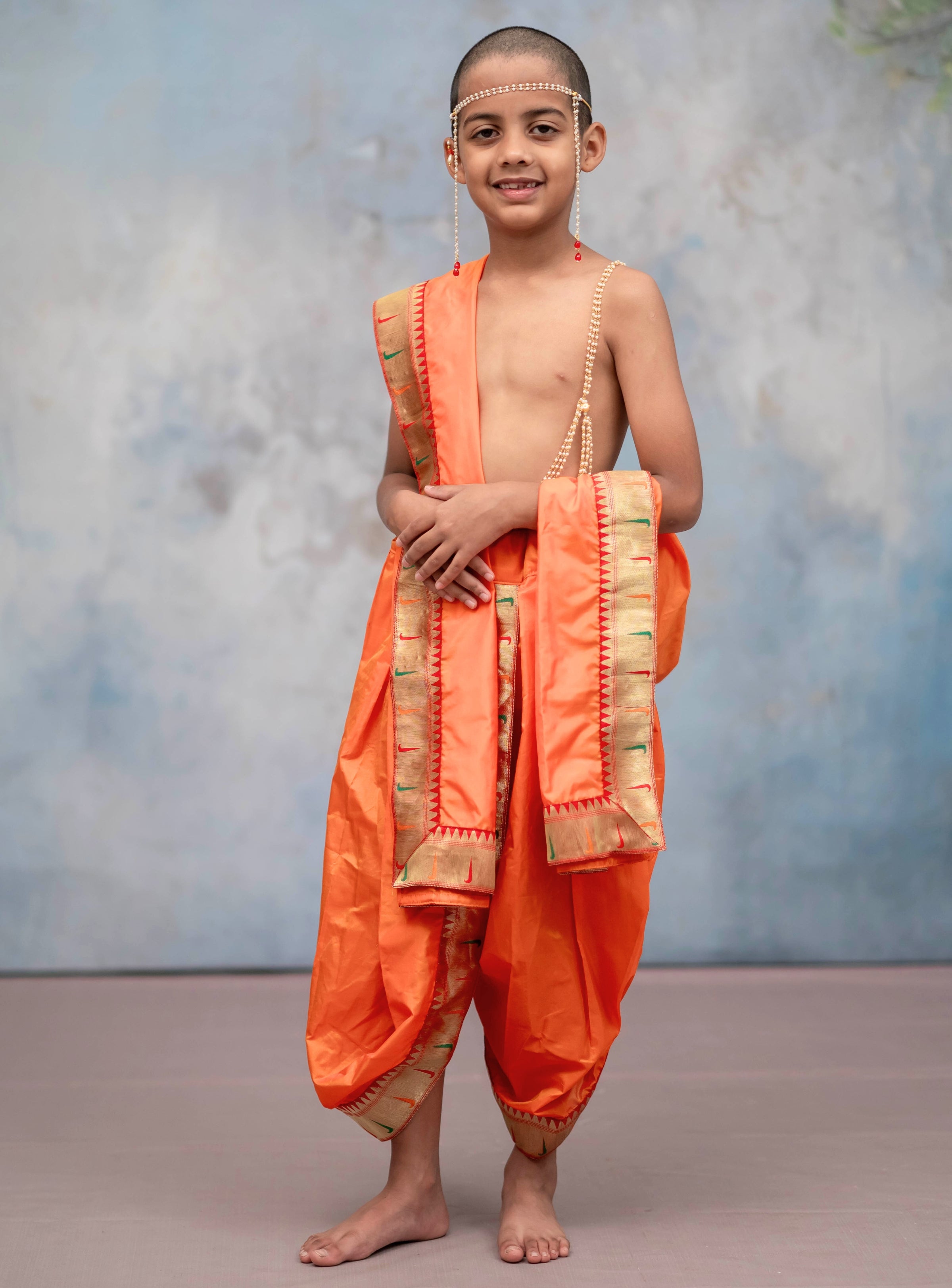 Saffron Mysore silk sovale uparane set with Muniya Paithani border for Batu.Pre-stitched sovale uparane set includes Ready to wear Sovale & Uparane/Upavastra.Can be paired with a short kurta.This Set is ideal for rituals like Matrubhojan,Muhurt during Munj/Upanayan/Vratabandha/Thread Ceremony.