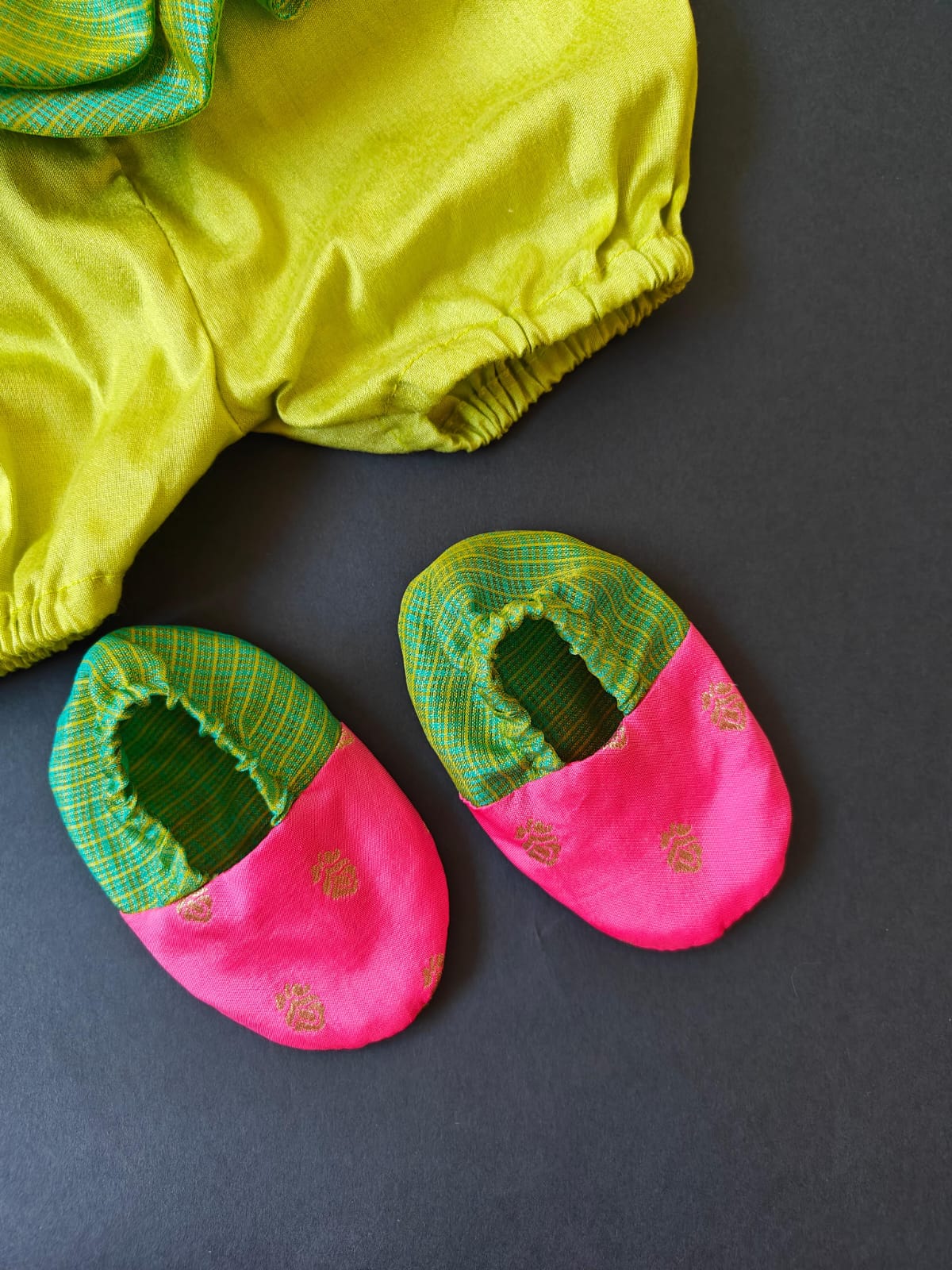 Pink soft brocade & green front open layered dress with bloomer,headband,booties for a newborn baby girl.It's the perfect outfit for your baby's naming ceremony,naamkaran or annaprashan ceremony.Traditional dress for Noolukettu Ceremony,Pachavi Puja,cradle ceremony,Rice Ceremony,Chatti Puja etc. Apt gifting idea