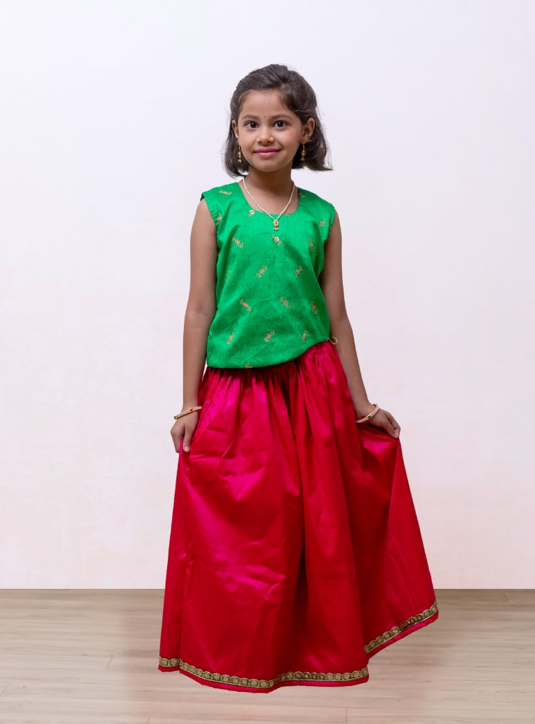 Rani pink soft taffeta silk Ghagra with shocking parrot green asymmetric embroidered gajji silk choli for Girls.Let your princess be as comfortable as in her casuals with carefully designed and crafted Comfort Ethnic Wear by Soyara Ethnics. Keep her fashion quotient high with timeless patterns, vibrant combinations and royal textiles.