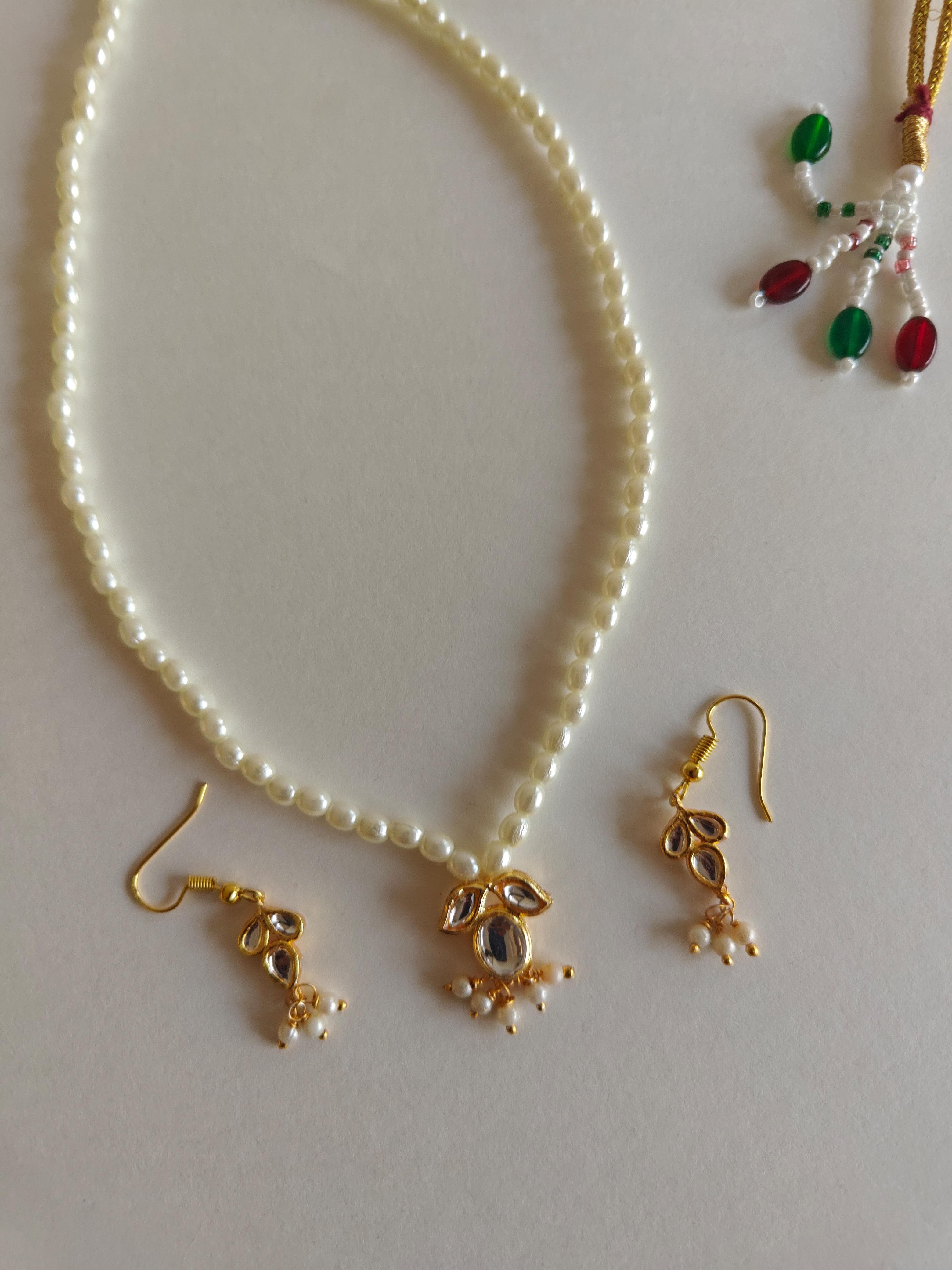 Mukta Set - Pearl chain necklace with Kundan pendant stringed pearls necklace with leaf shaped kundan studded pendant and matching earrings for Girls.