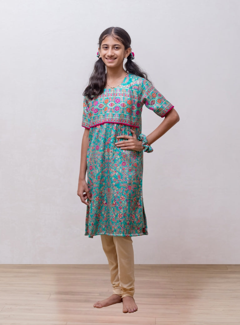 Turquoise soft silk Banaras brocade kurti with yoke pattern embellished with contrast pompom lace for Girls