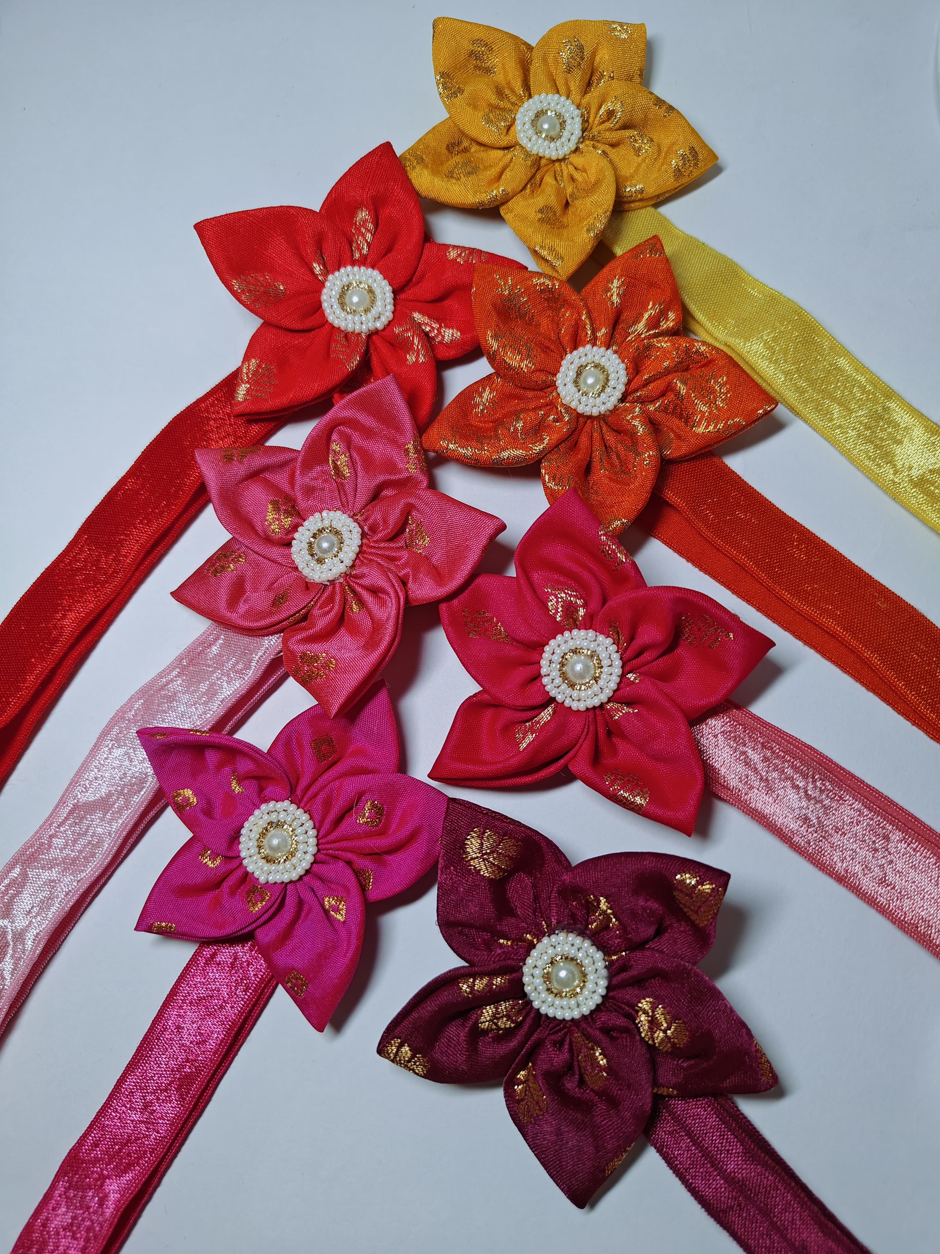 Bright Coloured Sadafuli Flower Stretchable headband for baby girl.Adorn your princess with head to toe premium quality handcrafted accessories made from allergy free, best quality materials.