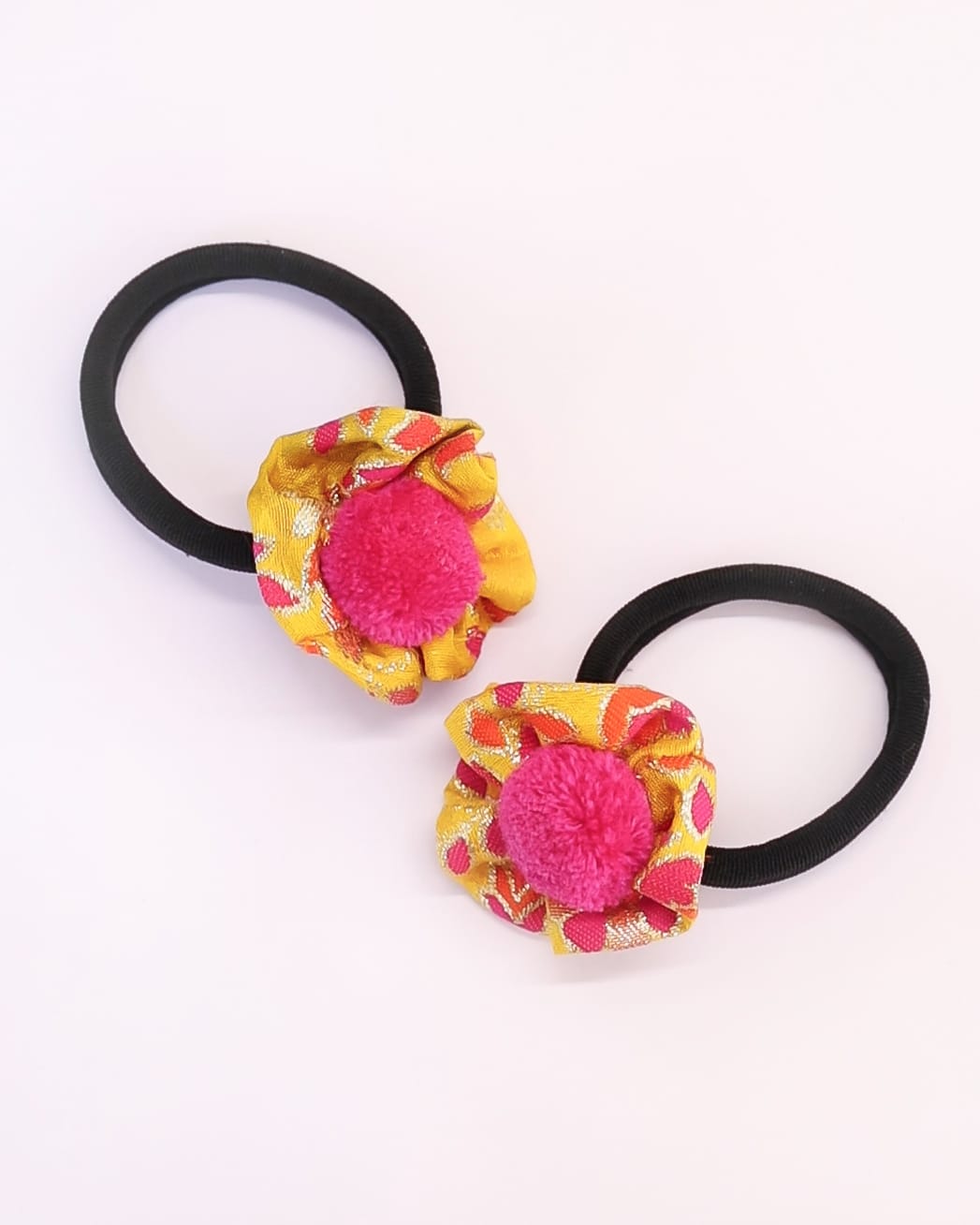 Set of two rubber bands with Yellow Banaras Silk handmade flower embellished with woolen pompom for Girls