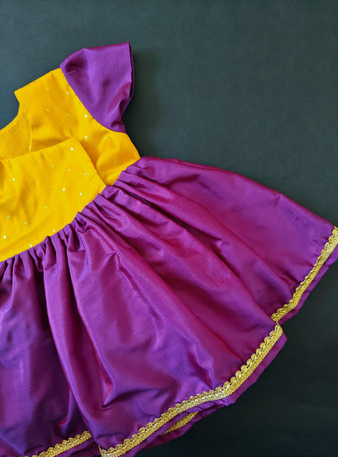 Yellow brocade & Purple silk front open dress for new born Baby Girl provides max comfort. It's the perfect outfit for your baby's naming ceremony , naamkaran or annaprashan ceremony. Traditional and ethnic dress for Noolukettu Ceremony, Pachavi Puja, cradle ceremony,Rice Ceremony,Chatti Puja etc. Apt gifting idea.