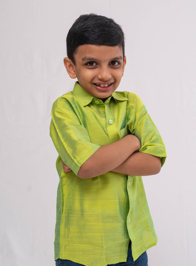 Parrot Green Plain Raw silk half sleeved shirt for Boys.This Parrot Green Plain Raw silk half sleeved shirt is designed for boys, providing both comfort and style.