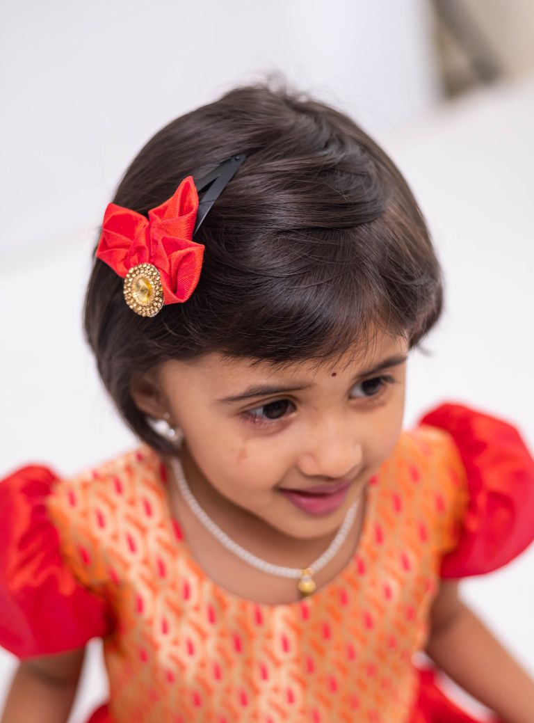 Orange banaras brocade with coral orange raw silk flared cap sleeved dress for Girls. Elevate any occasion with this unique piece.Let your princess be as comfortable as in her casuals with carefully designed and crafted Comfort Ethnic Wear by Soyara Ethnics.