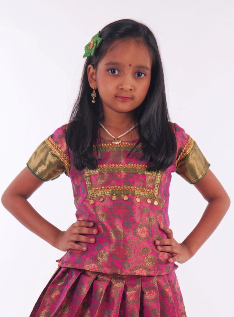 Pink and Dark Green woven banarasi jacquard brocade Pattu Pavada Parkar Polka set with a heavy yoke pattern for Girls.Let your princess be as comfortable as in her casuals with carefully designed & crafted Comfort Ethnic Wear by Soyara Ethnics.Keep her fashion quotient high with timeless patterns, vibrant combinations and royal textiles.