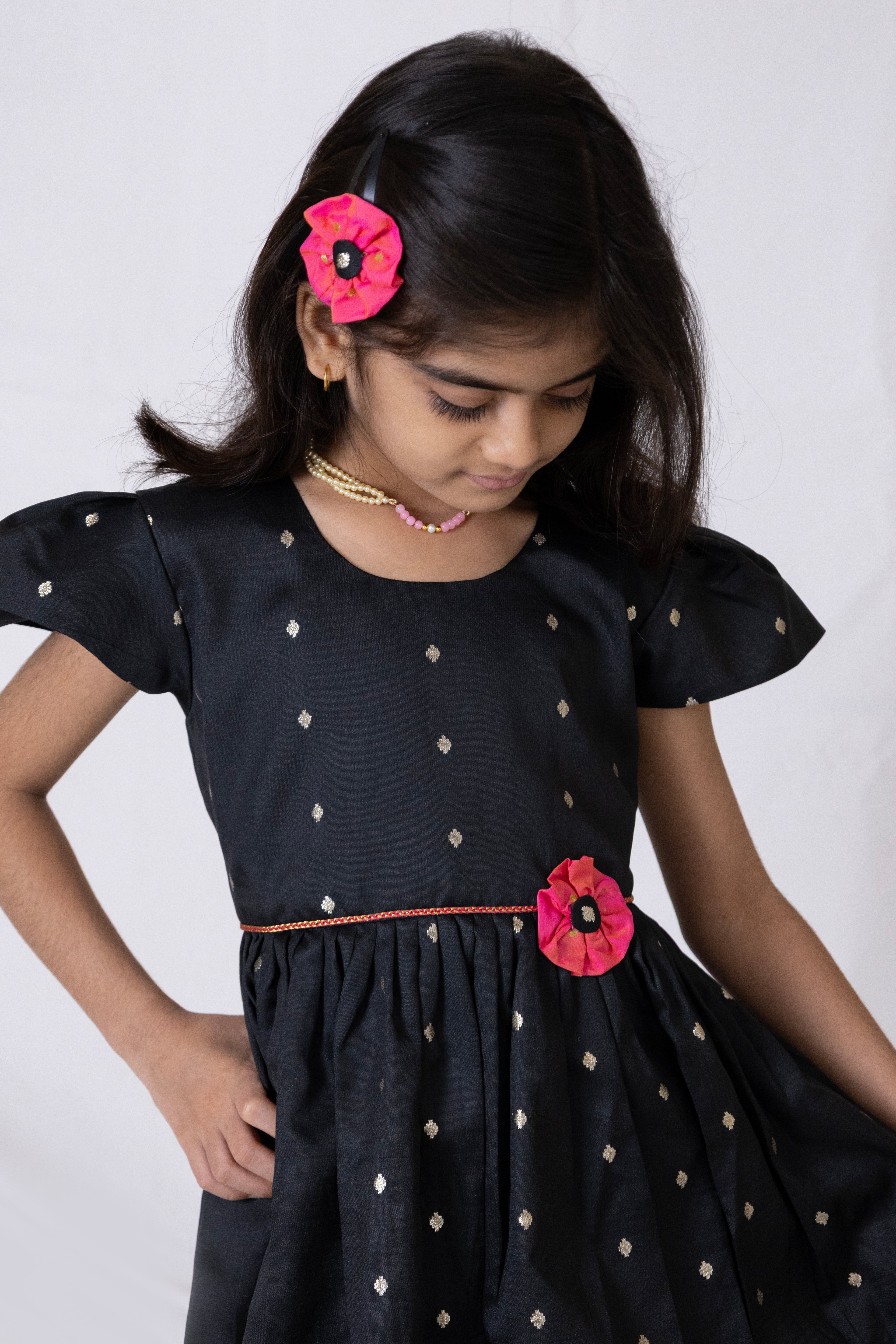Black taffeta silk flared dress with handmade pink fabric flower motif and chord waist belt for Girls