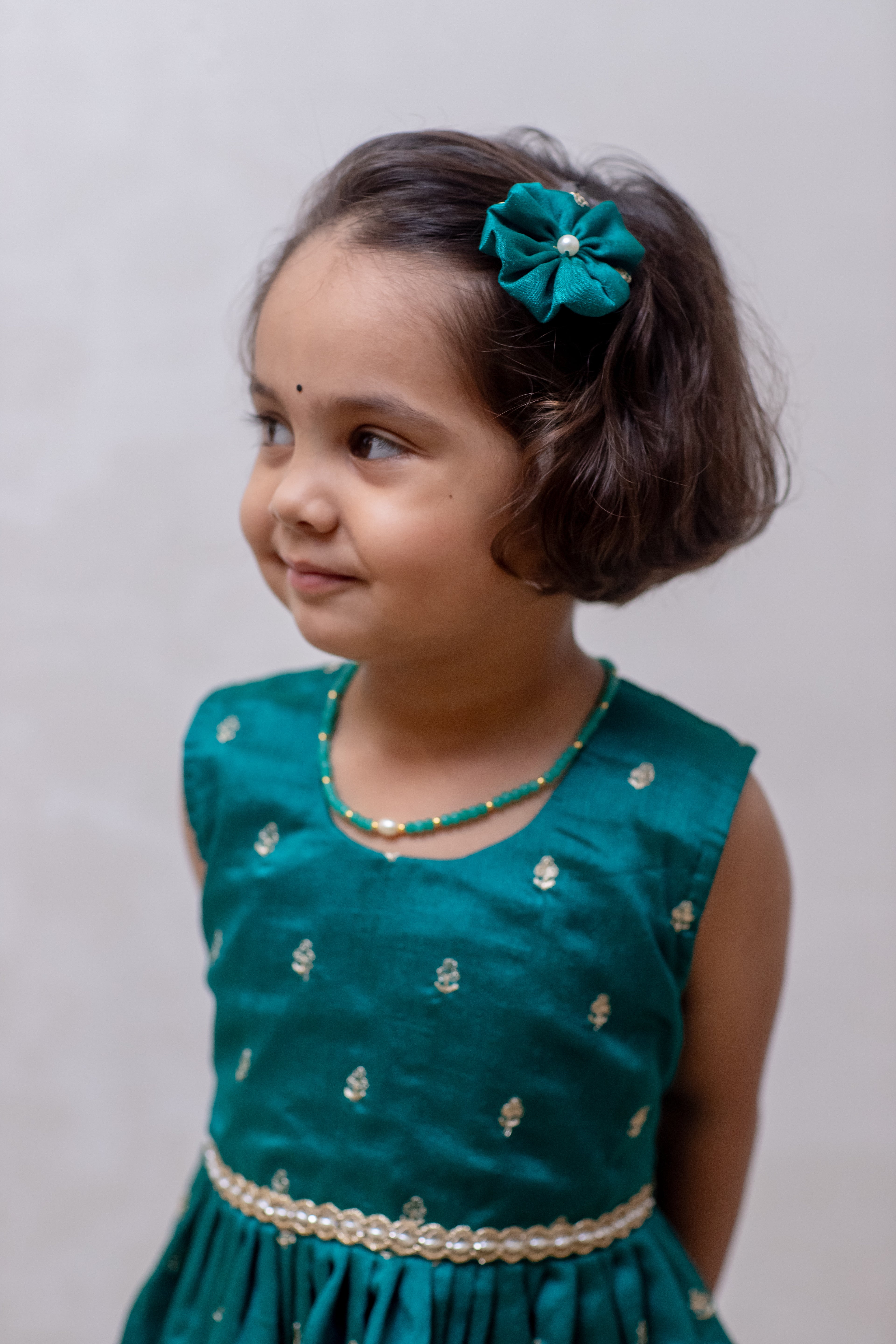 Aqua green Vichitra silk sleeveless dress for Girls.Let your princess be as comfortable as in her casuals with carefully designed and crafted Comfort Ethnic Wear by Soyara Ethnics. Keep her fashion quotient high with timeless patterns, vibrant combinations and royal textiles.