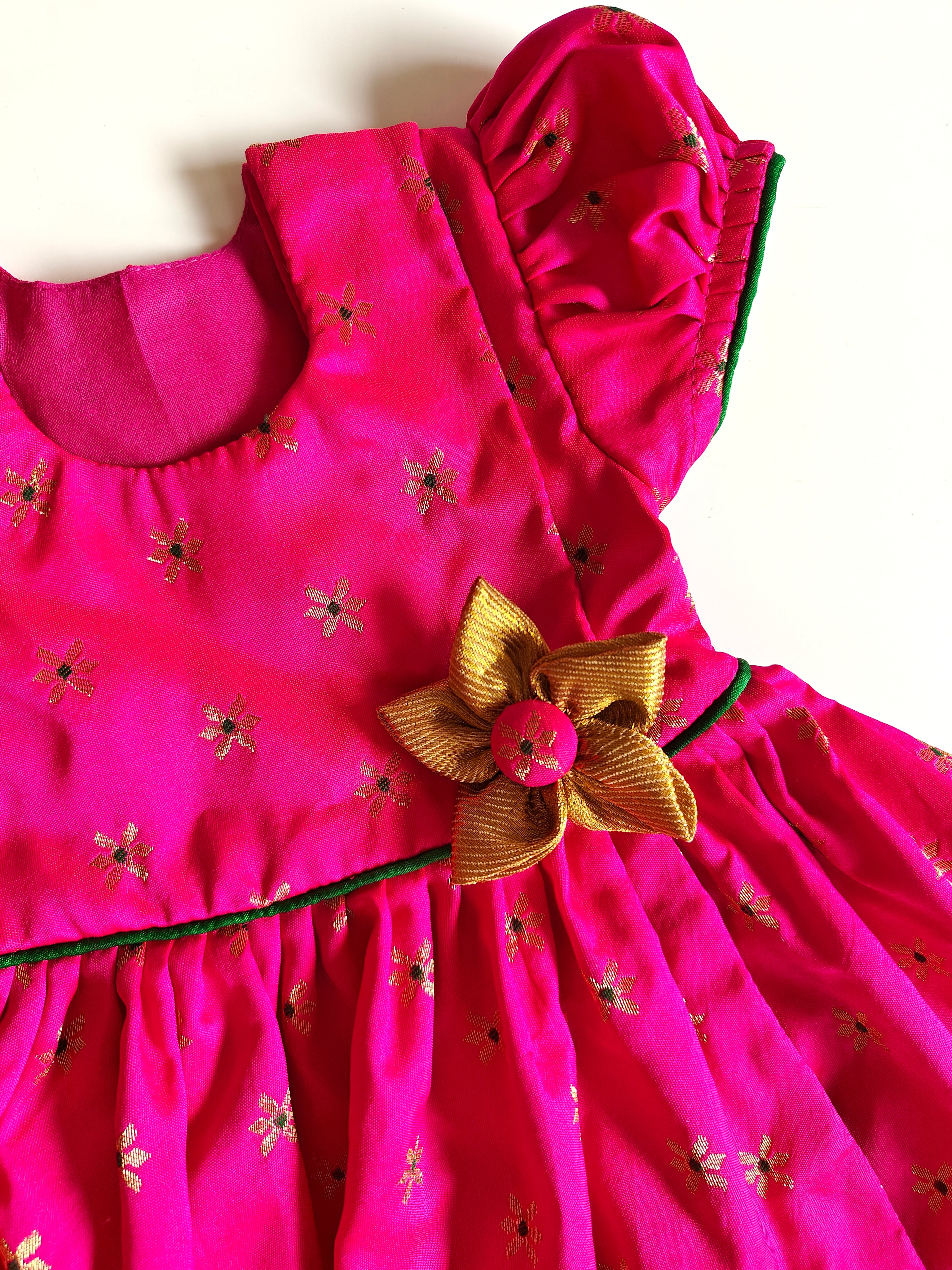 Sadafuli set - Rani Pink brocade silk front open frock with puff sleeves,embellished with a handmade fabric flower for Baby Girls.It's the perfect outfit for your baby's naming ceremony,naamkaran or annaprashan ceremony.Traditional dress for Noolukettu Ceremony,Pachavi Puja,cradle ceremony,Rice Ceremony,Chatti Puja etc.