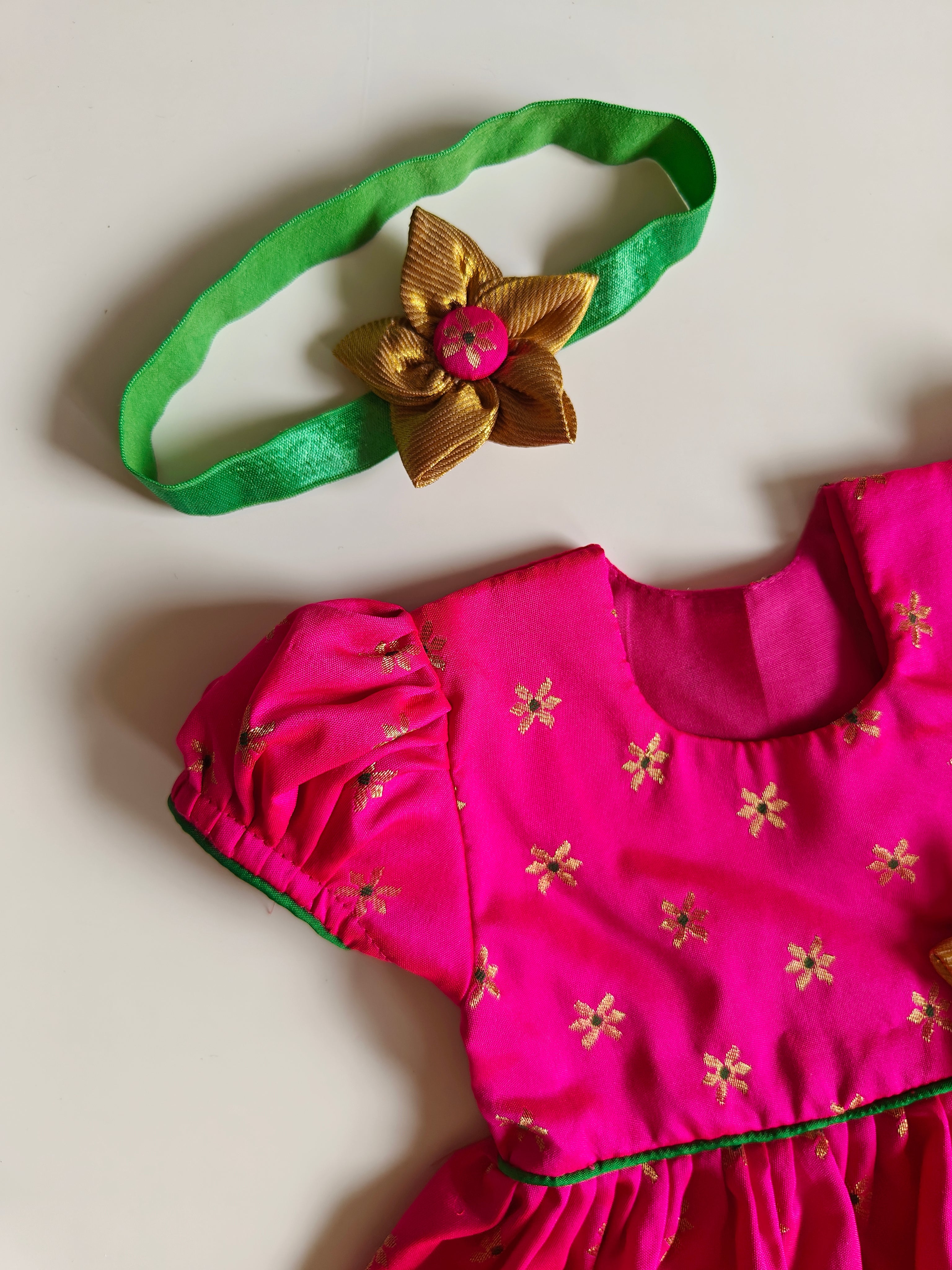 Sadafuli set - Rani Pink brocade silk front open frock with puff sleeves,embellished with a handmade fabric flower for Baby Girls.It's the perfect outfit for your baby's naming ceremony,naamkaran or annaprashan ceremony.Traditional dress for Noolukettu Ceremony,Pachavi Puja,cradle ceremony,Rice Ceremony,Chatti Puja etc.