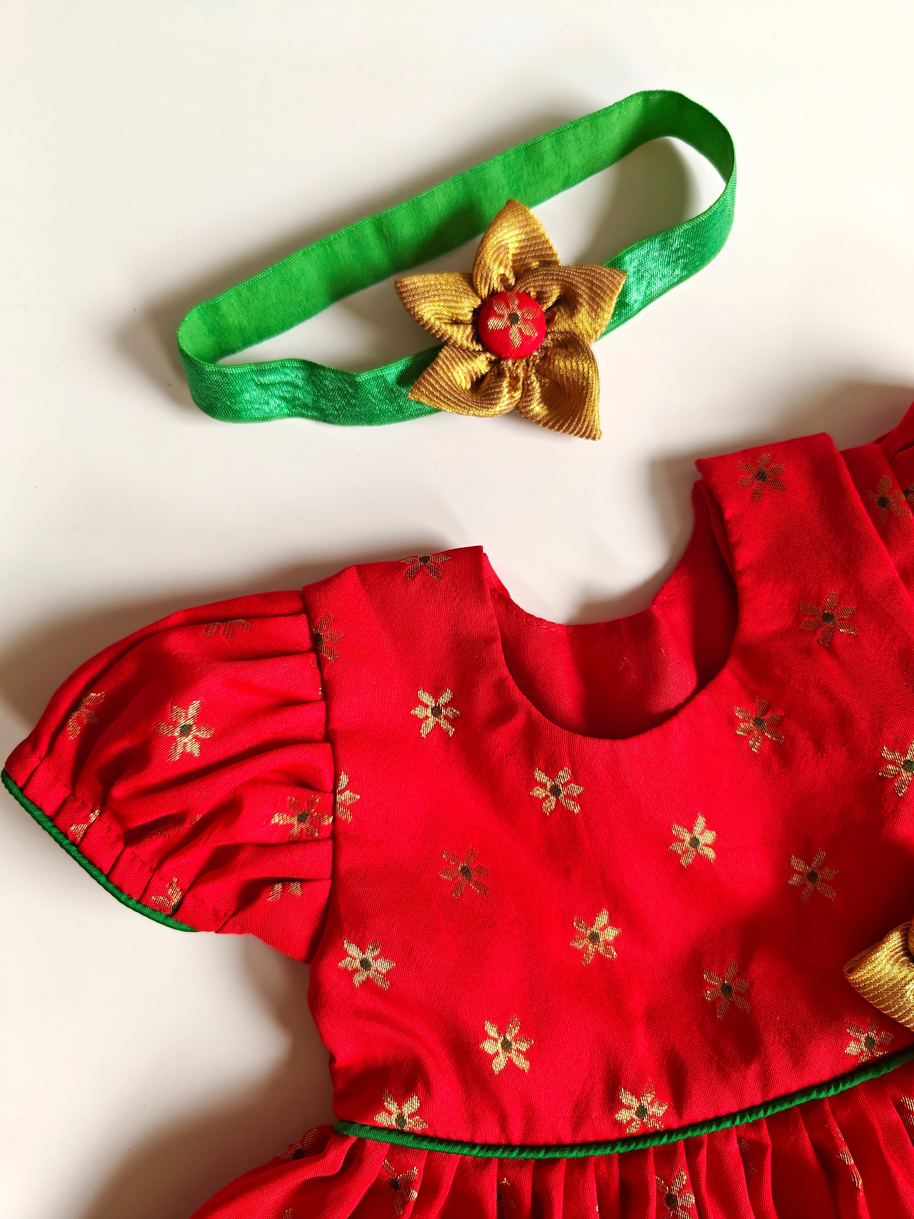 Sadafuli set - Red brocade silk front open frock with puff sleeves, embellished with a handmade fabric flower for Baby Girls.It's the perfect outfit for your baby's naming ceremony,naamkaran or annaprashan ceremony.Traditional dress for Noolukettu Ceremony,Pachavi Puja,cradle ceremony,Rice Ceremony,Chatti Puja etc.