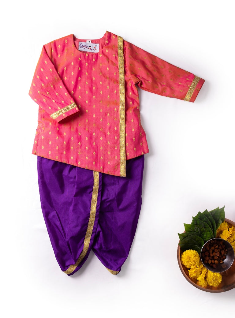 Blush pink brocade asymmetric kurta teamed with purple mysore silk dhoti for Newborn Baby Boy.It's the perfect outfit for your baby's naming ceremony,naamkaran,annaprashan ceremony.Traditional dress for Noolukettu Ceremony,Pachavi Puja,cradle ceremony,Rice Ceremony,Chatti Puja etc. Apt gifting idea.
