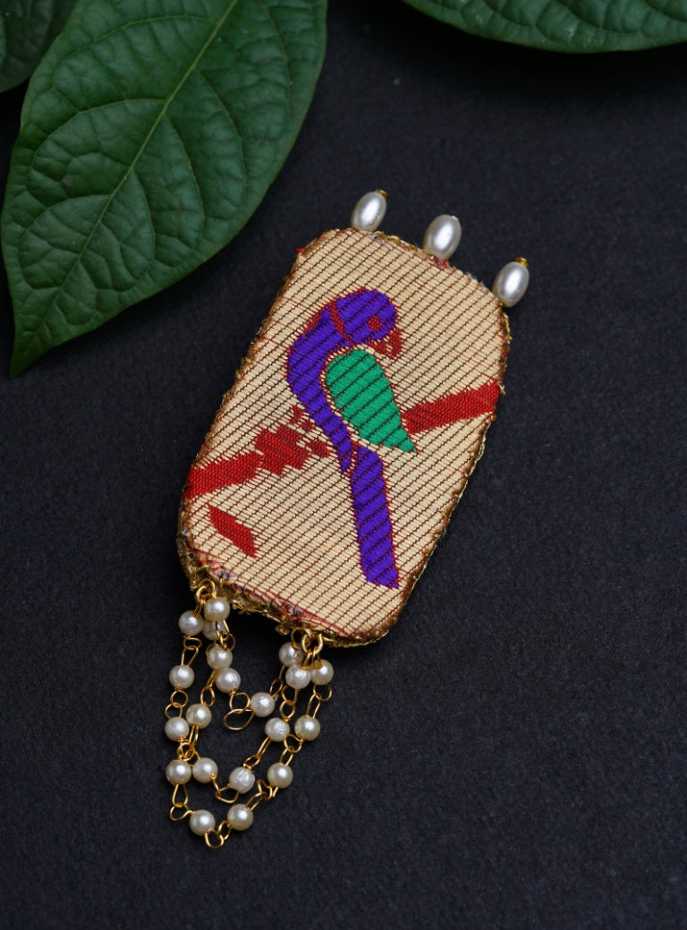 Handcrafted Parrot Paithani Brooch embellished with pearls and pearls strings.Perfect accessory for boys kurta. Mundavalya,kanthi,bhikbali,topi,pagdi are boys accessories exclusively designed using Pearls,glass beads,jadau & gold plated findings for Batu,for Upanayan/Vratabandha/munj /thread ceremony.