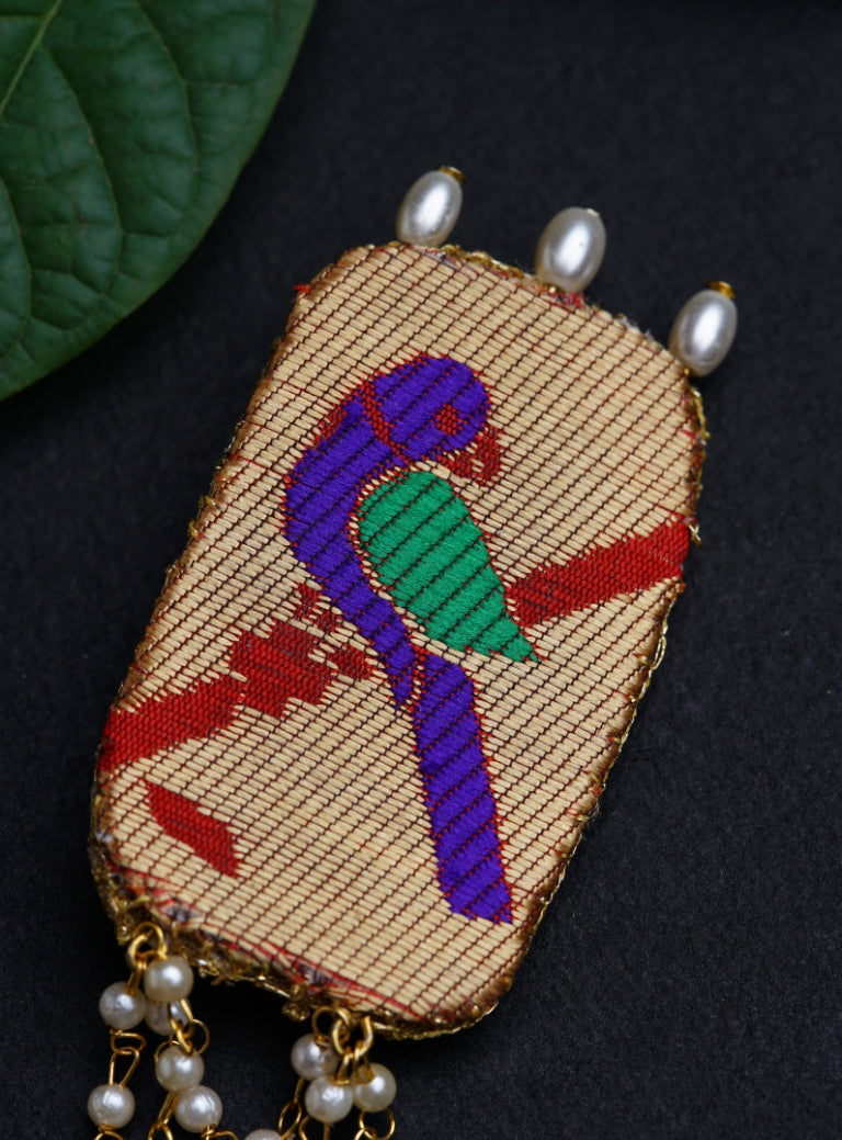 Handcrafted Parrot Paithani Brooch embellished with pearls and pearls strings.Perfect accessory for boys kurta. Mundavalya,kanthi,bhikbali,topi,pagdi are boys accessories exclusively designed using Pearls,glass beads,jadau & gold plated findings for Batu,for Upanayan/Vratabandha/munj /thread ceremony.
