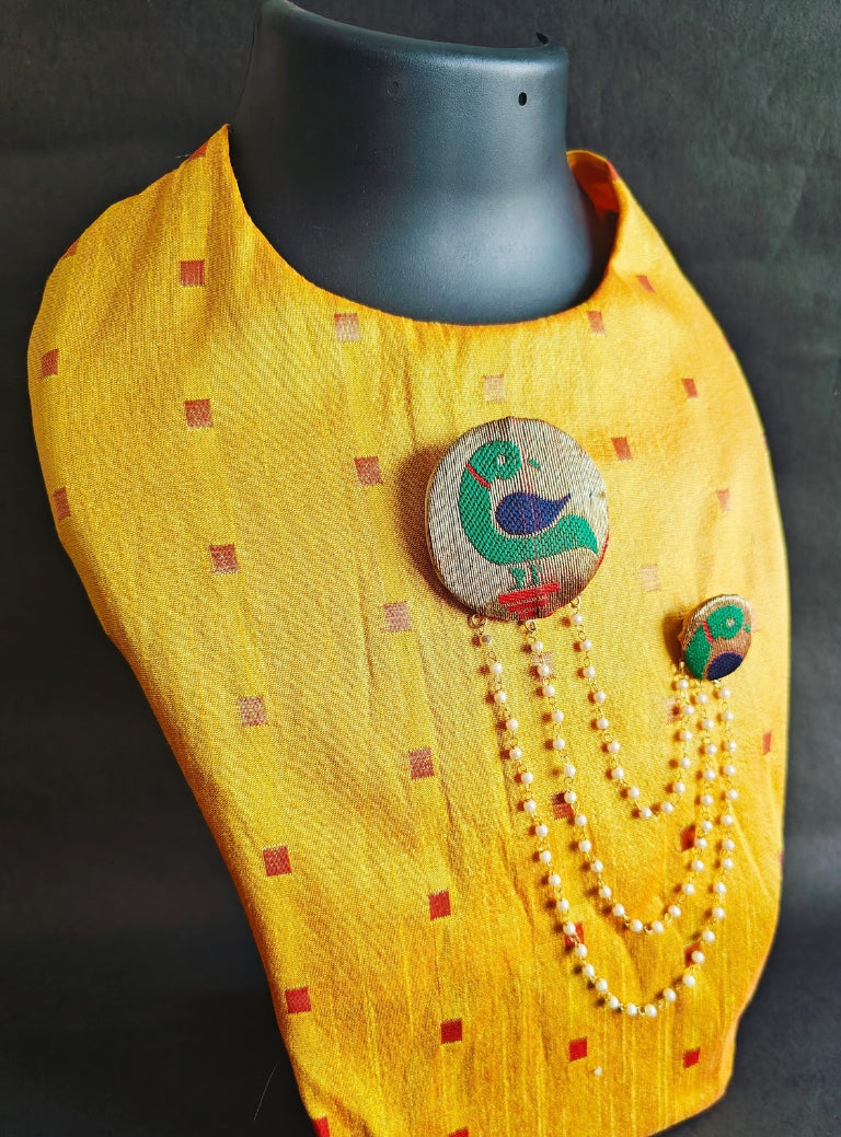 Handcrafted Parrot Paithani Brooch embellished with pearls and pearls strings.Perfect accessory for boys kurta. Mundavalya,kanthi,bhikbali,topi,pagdi are boys accessories exclusively designed using Pearls,glass beads,jadau & gold plated findings for Batu,for Upanayan/Vratabandha/munj /thread ceremony.