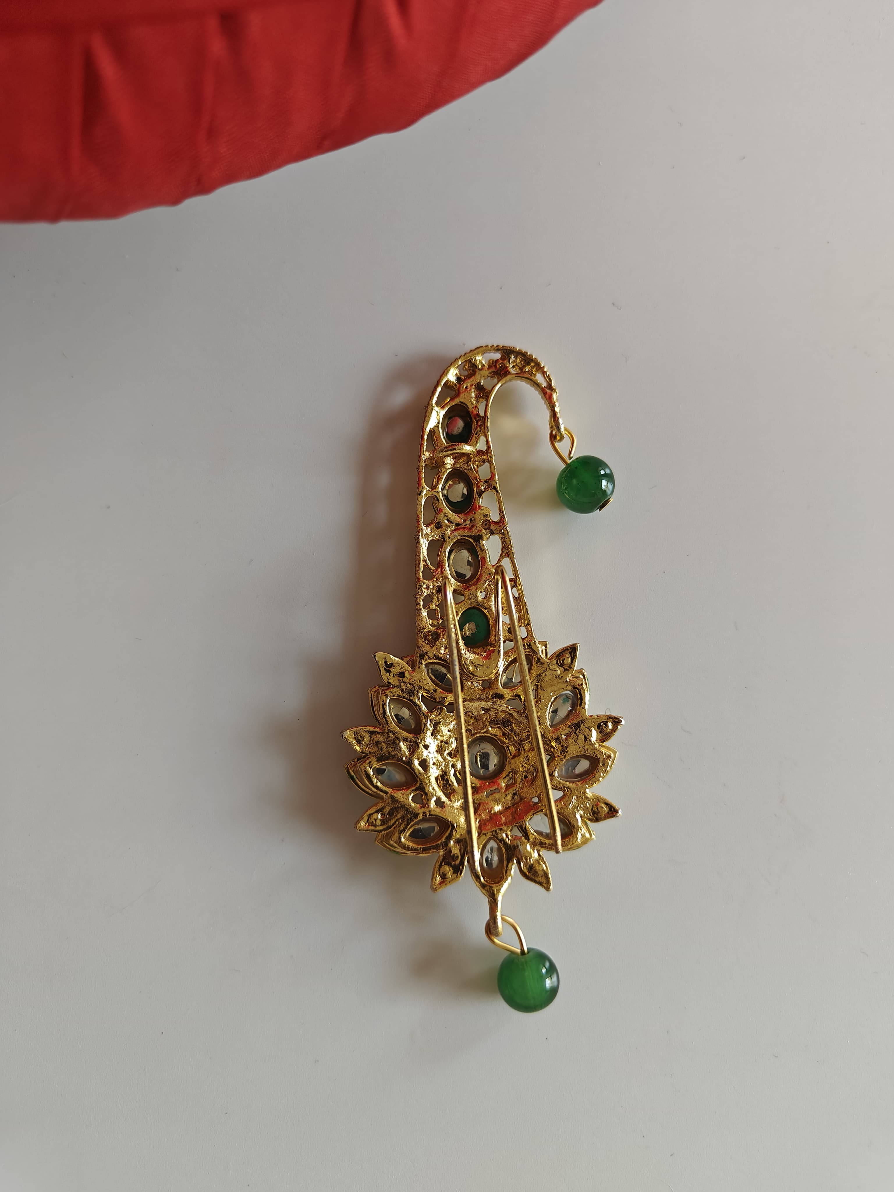 Green and white Kundan Jadau pagadi brooch for batu or groom.