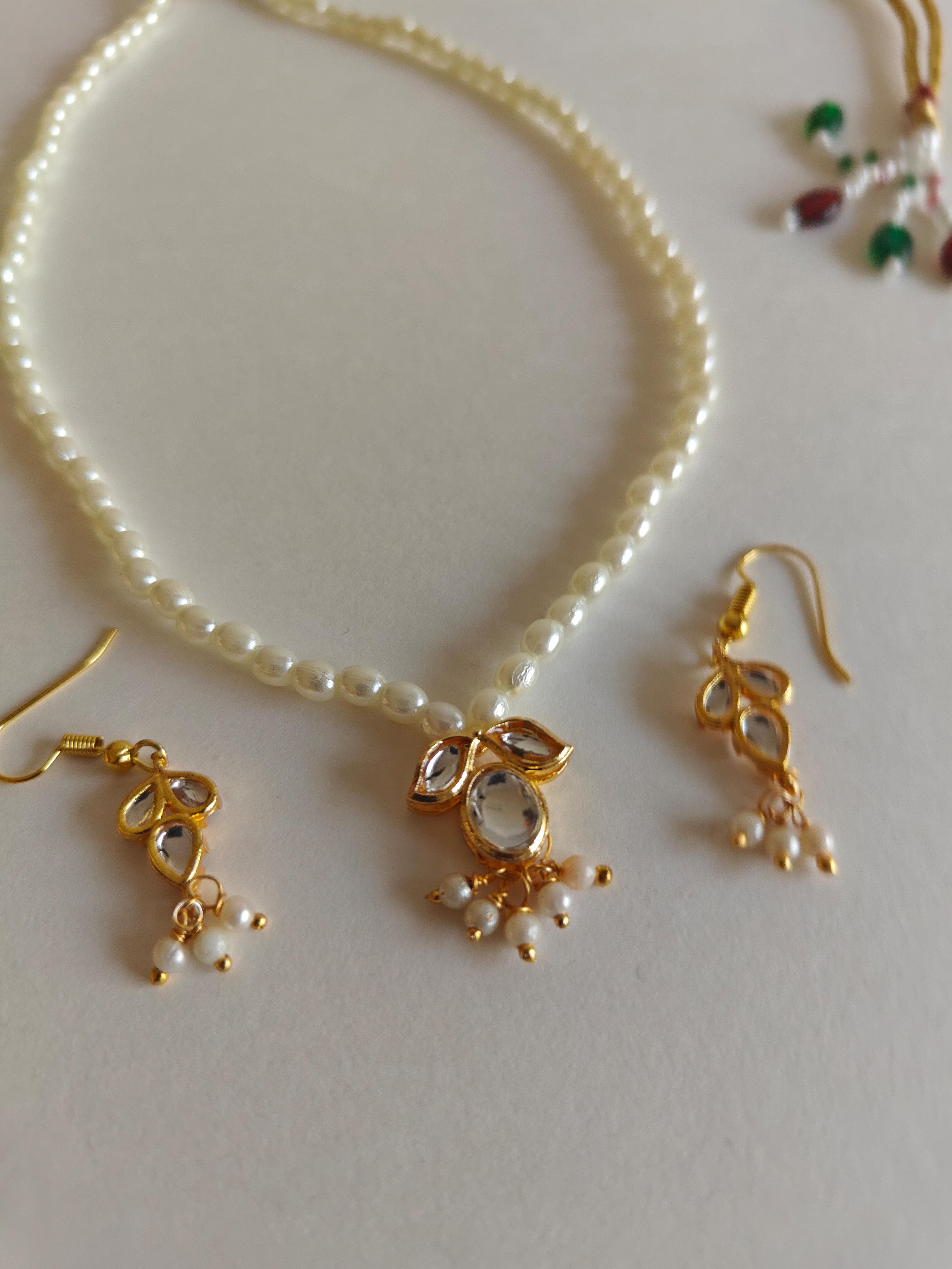 Mukta Set - Pearl chain necklace with Kundan pendant stringed pearls necklace with leaf shaped kundan studded pendant and matching earrings for Girls.