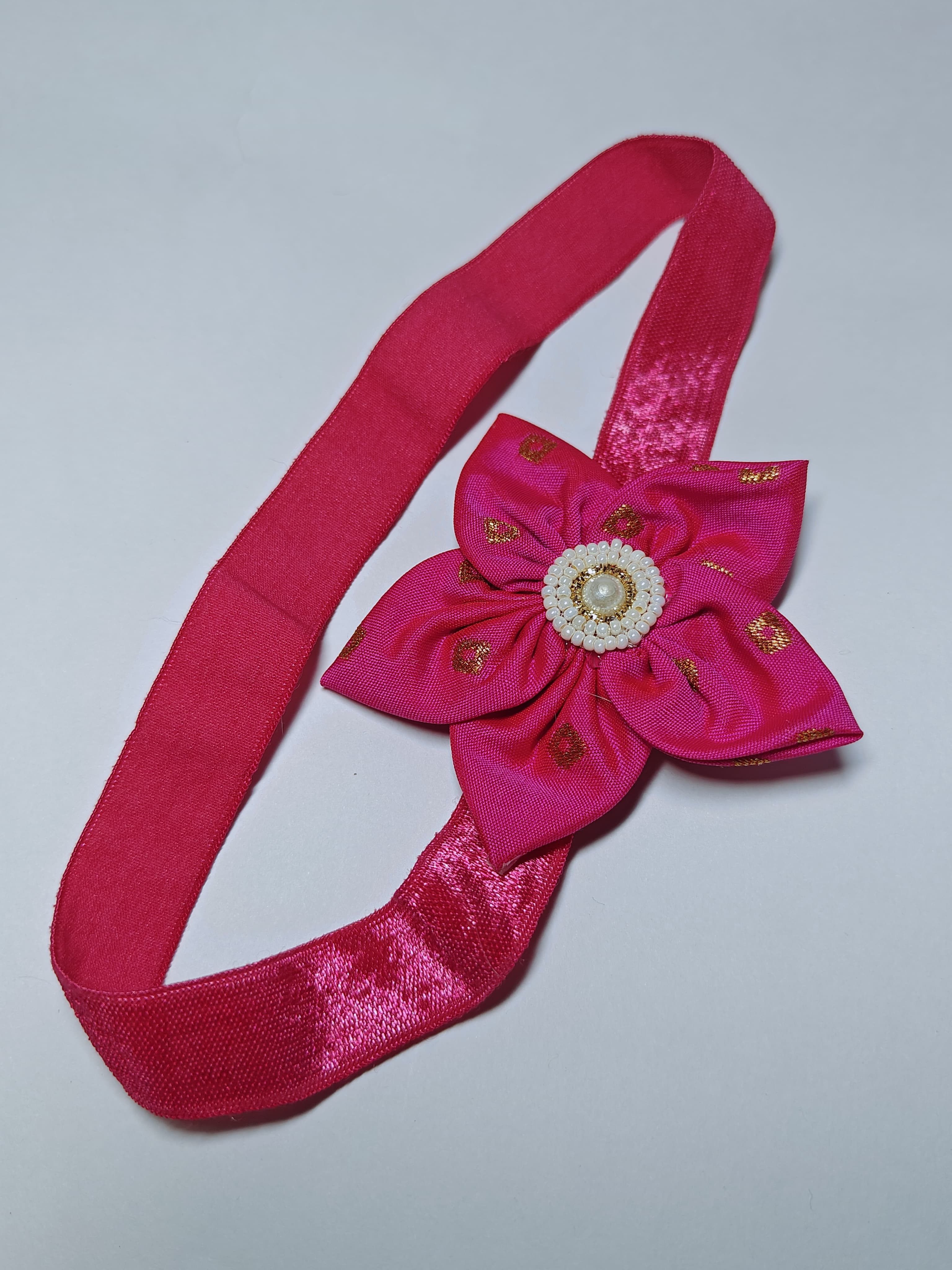 Bright Coloured Sadafuli Flower Stretchable headband for baby girl.Adorn your princess with head to toe premium quality handcrafted accessories made from allergy free, best quality materials.