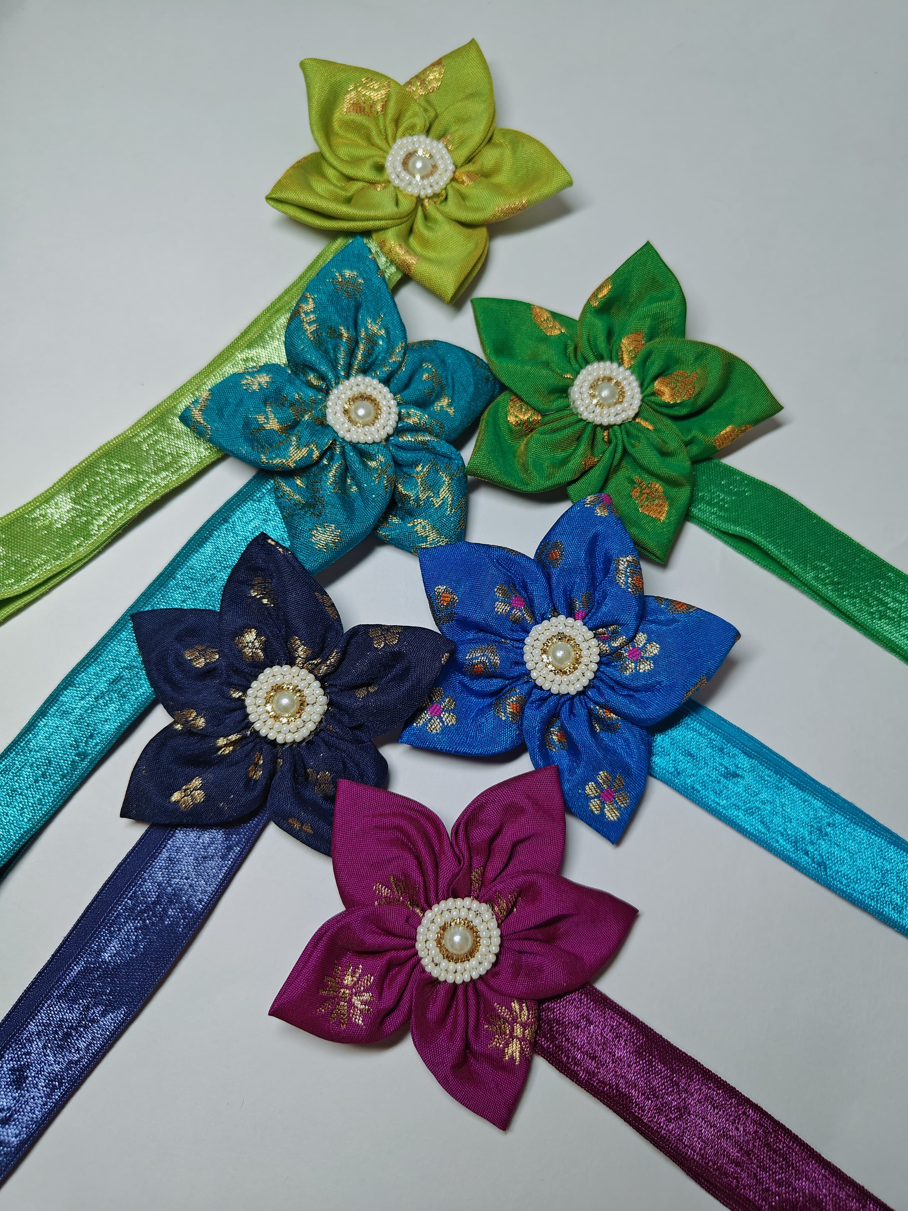 Cool Coloured Sadafuli Flower Stretchable headband for baby girl.Adorn your princess with head to toe premium quality handcrafted accessories made from allergy free, best quality materials.