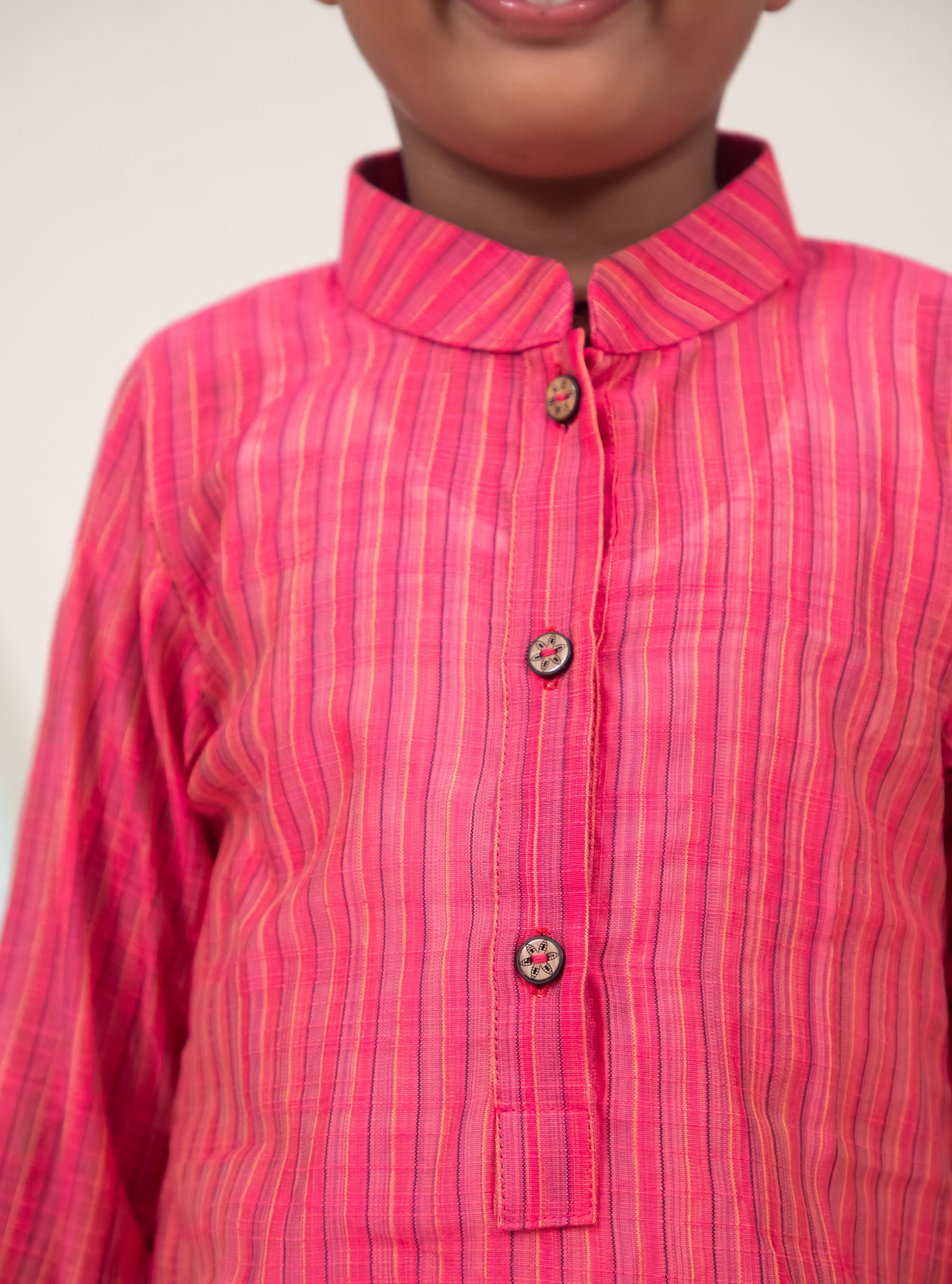 Pink Cotton silk striped regular stand collar kurta.Kurtas with collar or Angarakha pattern teamed with salwar are the best choice for any festive occasion for boys. They are Trendy, Easy to wear and comfortable to carry.