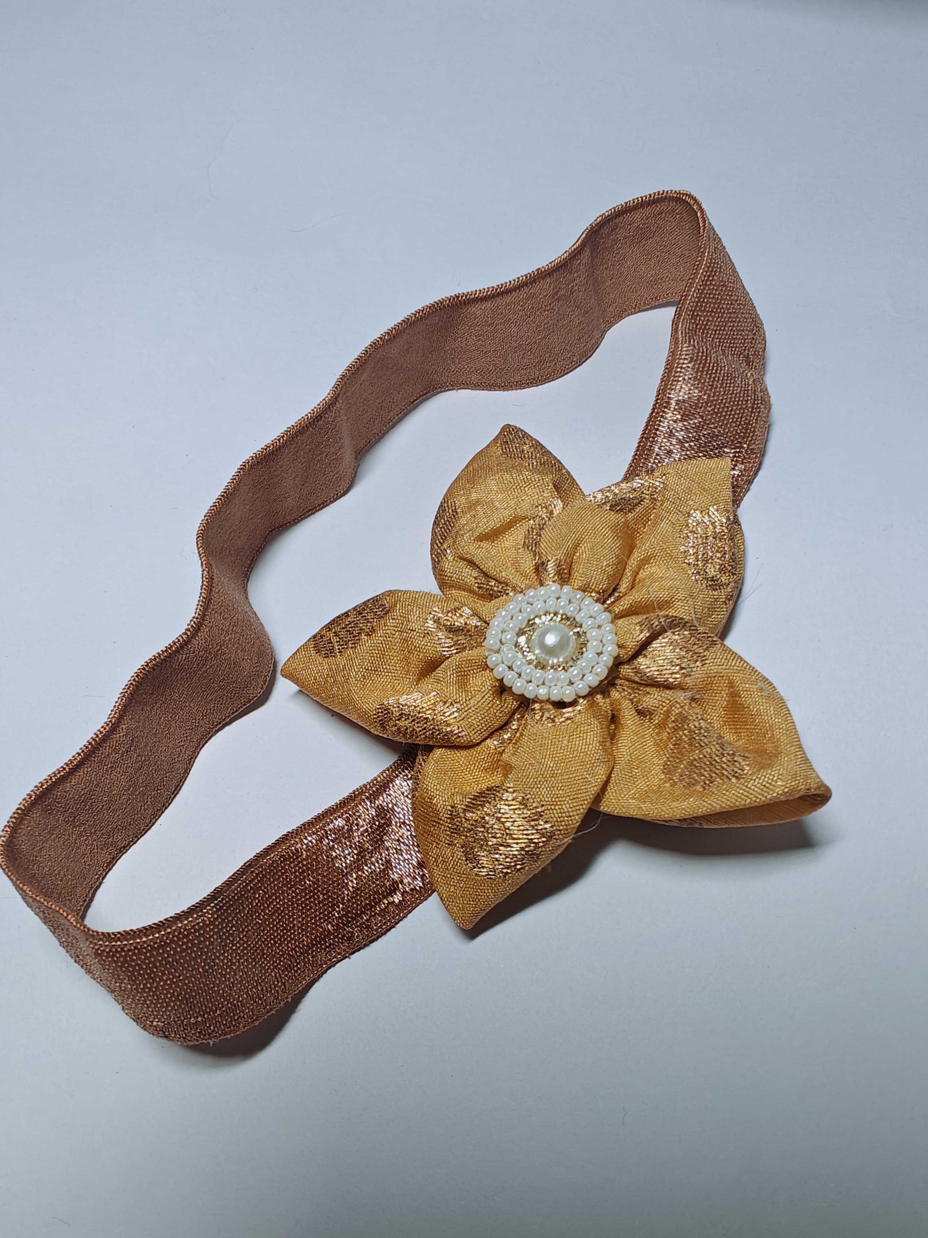 Golden Sadafuli Flower Stretchable headband for baby girl.