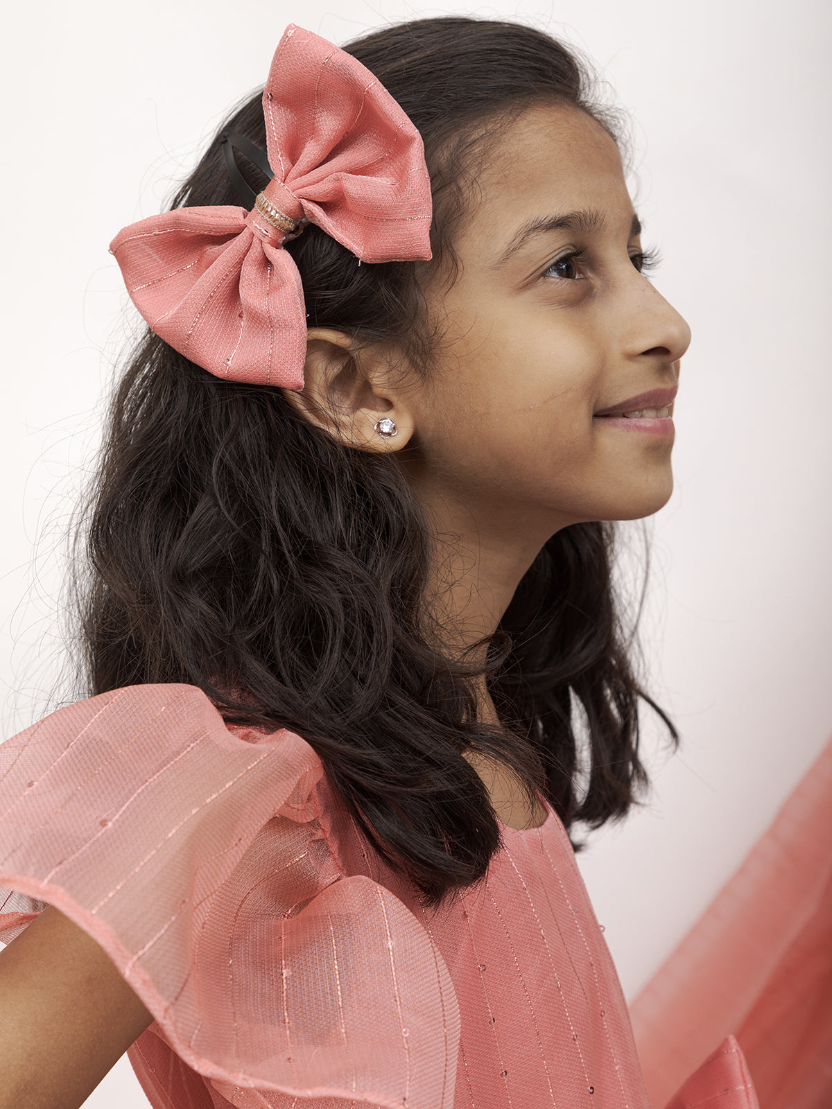 Peach Sequined Kotta Organza Flared Dress With a dainty lace and a statement Bow at waist for Girl.Let your princess be as comfortable as in her casuals with carefully designed & crafted Comfort Ethnic Wear by Soyara Ethnics.Keep her fashion quotient high with timeless patterns, vibrant combinations and royal textiles.