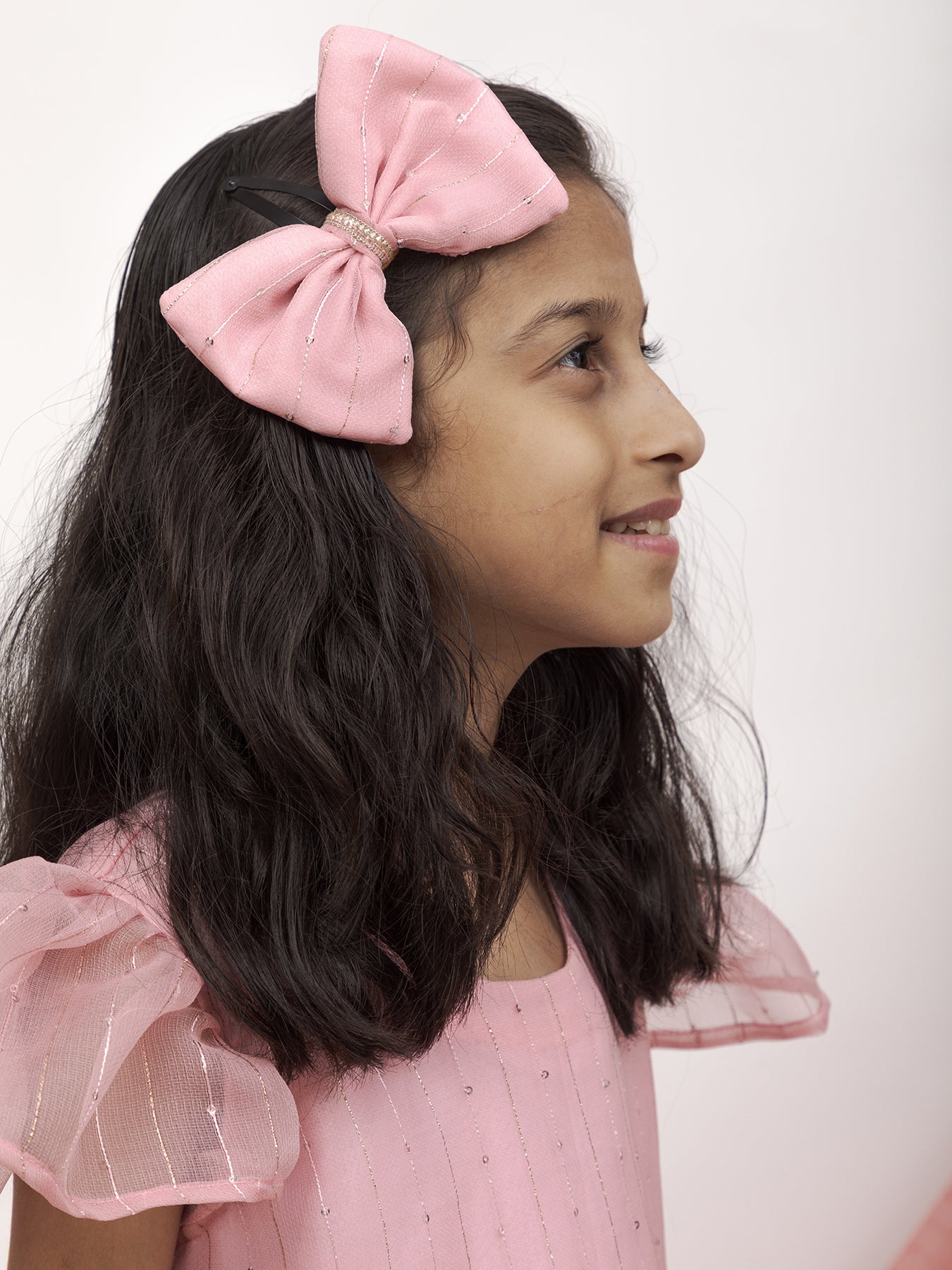 Baby Pink Sequined Kotta Organza Dress With a dainty lace & a statement Bow at waist for Girl.Let your princess be as comfortable as in her casuals with carefully designed & crafted Comfort Ethnic Wear by Soyara Ethnics.Keep her fashion quotient high with timeless patterns,vibrant combinations and royal textiles.