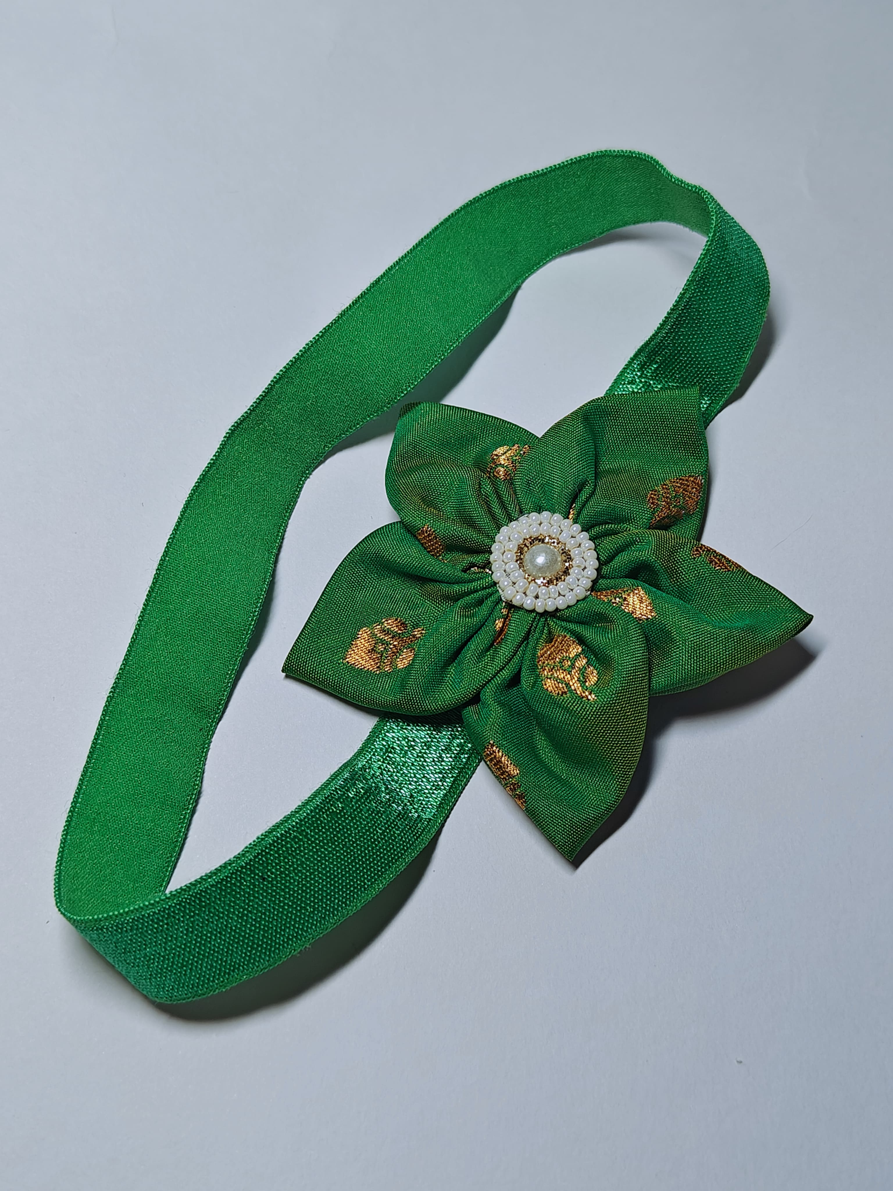 Cool Coloured Sadafuli Flower Stretchable headband for baby girl.Adorn your princess with head to toe premium quality handcrafted accessories made from allergy free, best quality materials.