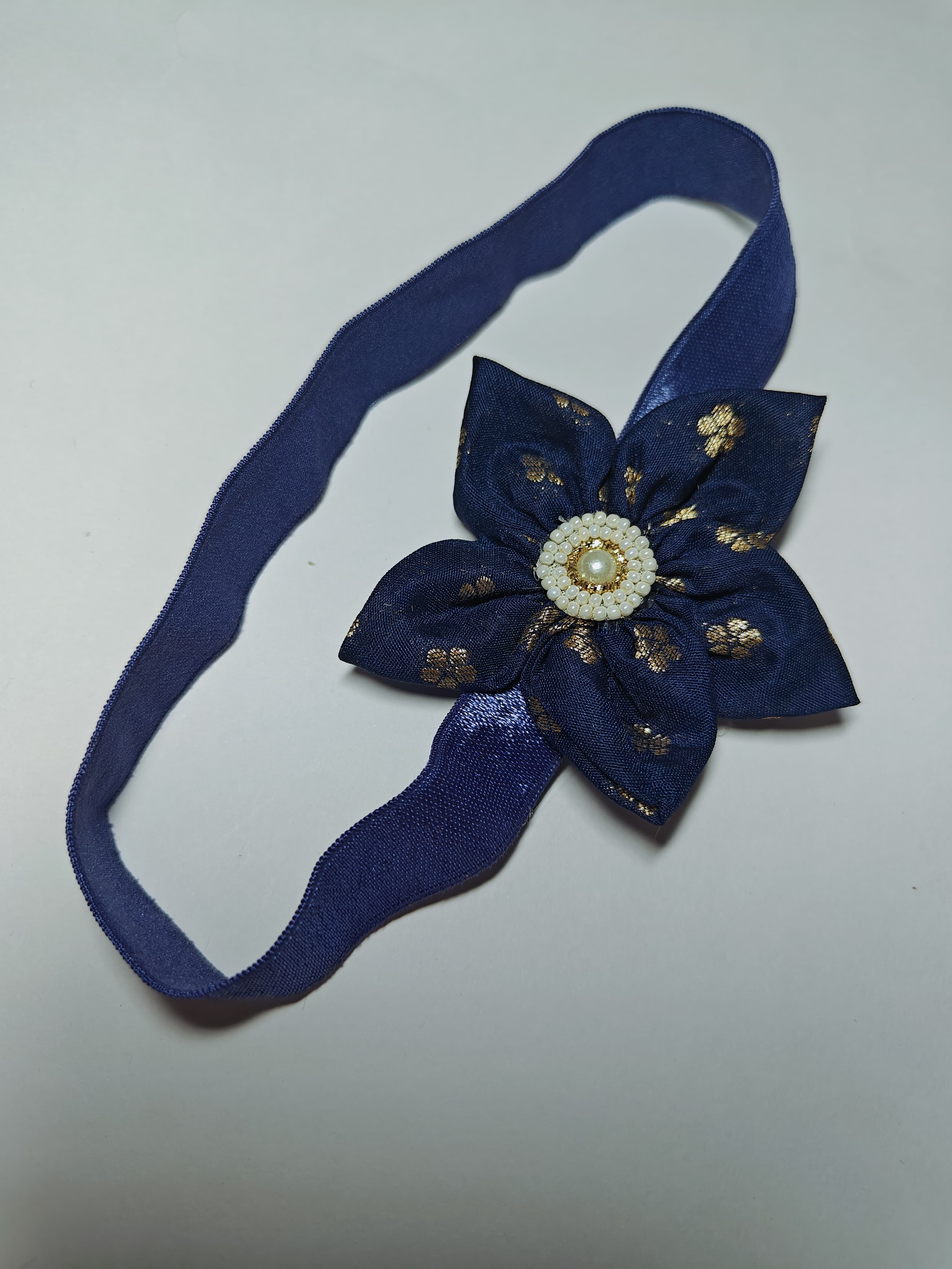 Cool Coloured Sadafuli Flower Stretchable headband for baby girl.Adorn your princess with head to toe premium quality handcrafted accessories made from allergy free, best quality materials.