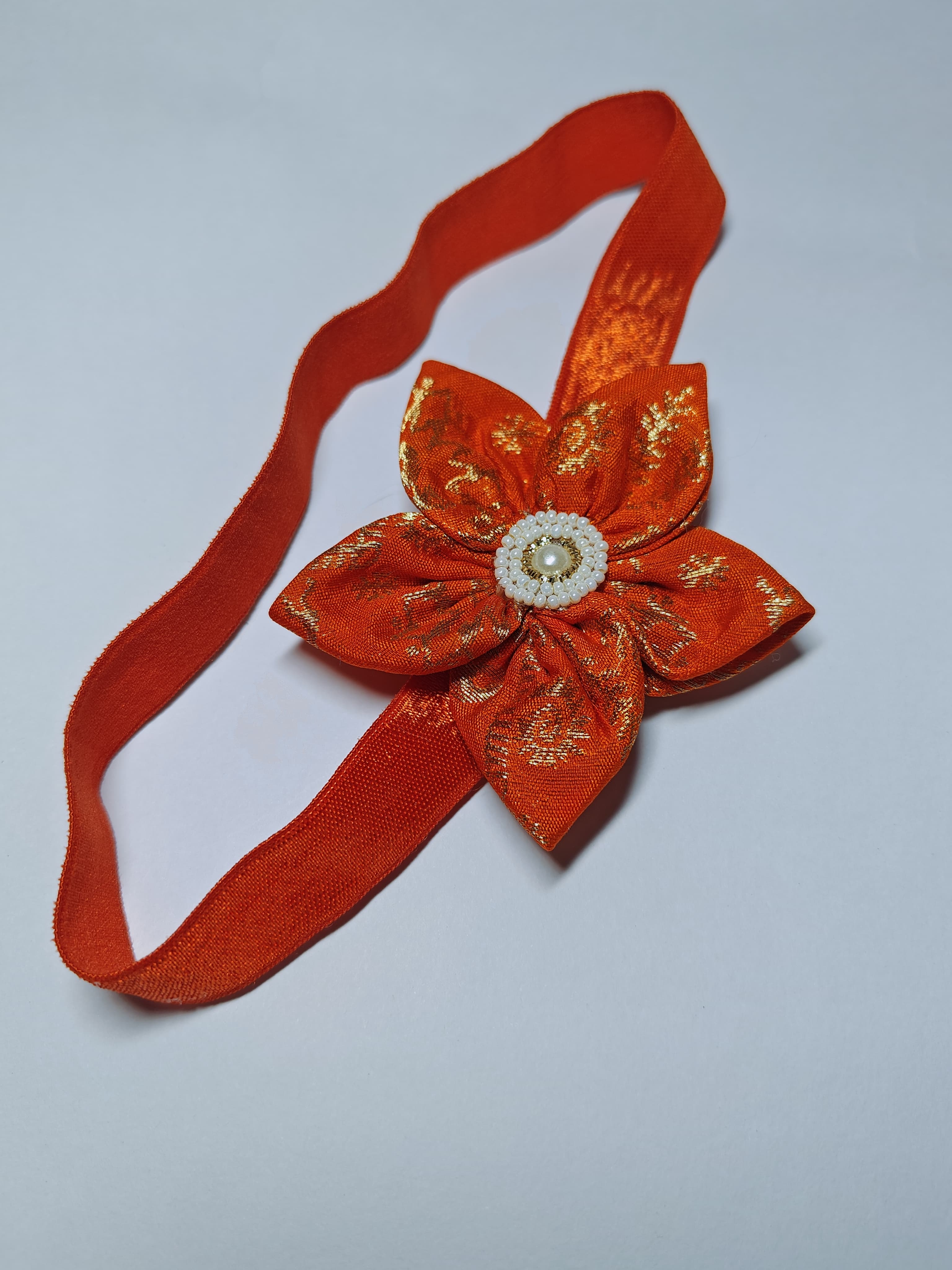 Bright Coloured Sadafuli Flower Stretchable headband for baby girl.Adorn your princess with head to toe premium quality handcrafted accessories made from allergy free, best quality materials.