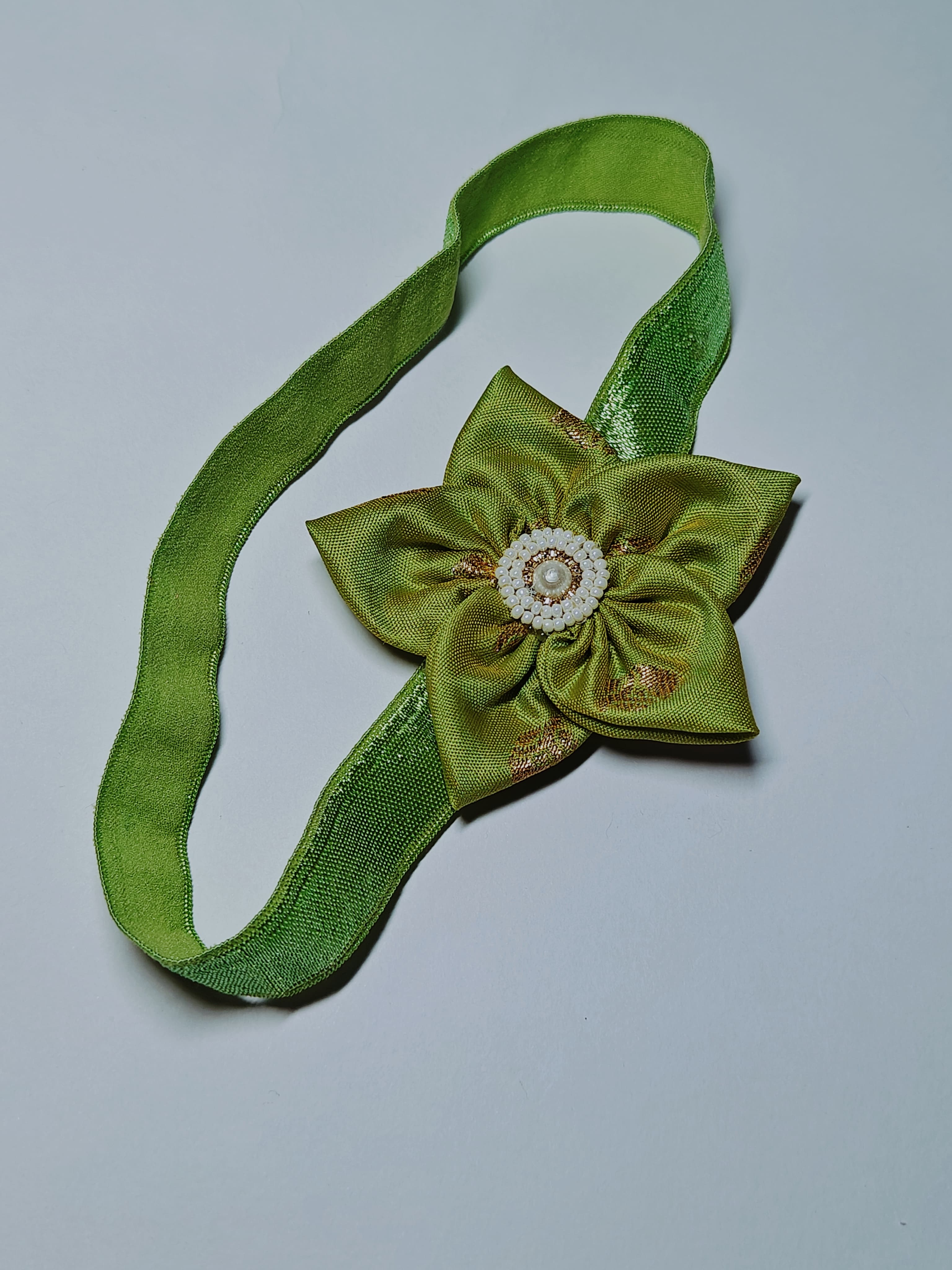 Cool Coloured Sadafuli Flower Stretchable headband for baby girl.Adorn your princess with head to toe premium quality handcrafted accessories made from allergy free, best quality materials.