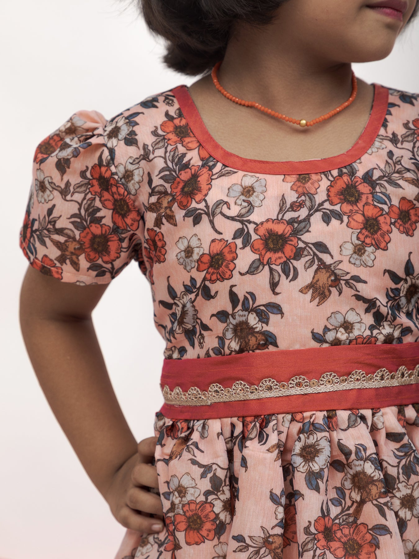 Peach Floral Chanderi Flared Dress With a dainty sequined lace pattern at waist for Girls.Let your princess be as comfortable as in her casuals with carefully designed & crafted Comfort Ethnic Wear by Soyara Ethnics.Keep her fashion quotient high with timeless patterns, vibrant combinations and royal textiles.