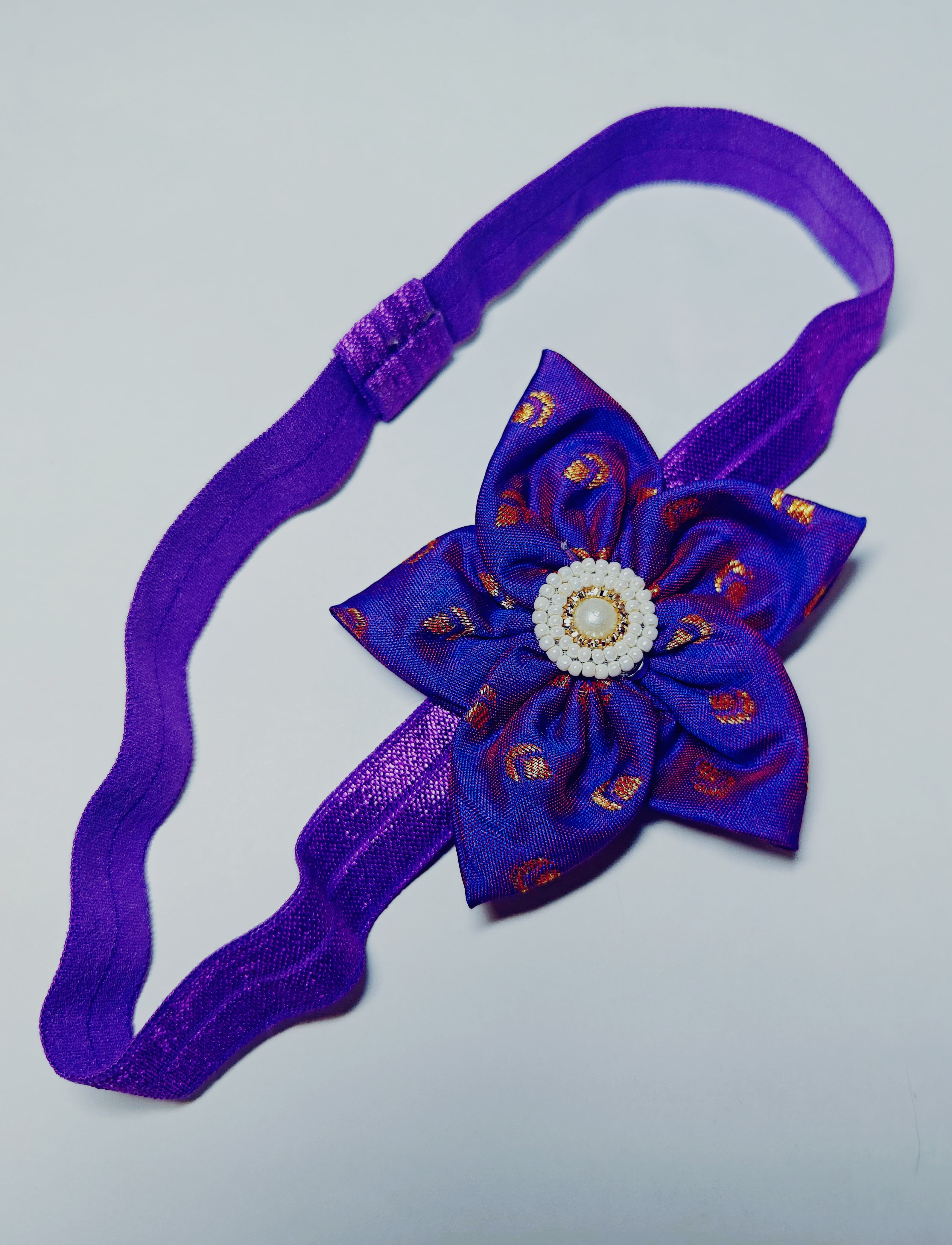 Cool Coloured Sadafuli Flower Stretchable headband for baby girl.Adorn your princess with head to toe premium quality handcrafted accessories made from allergy free, best quality materials.